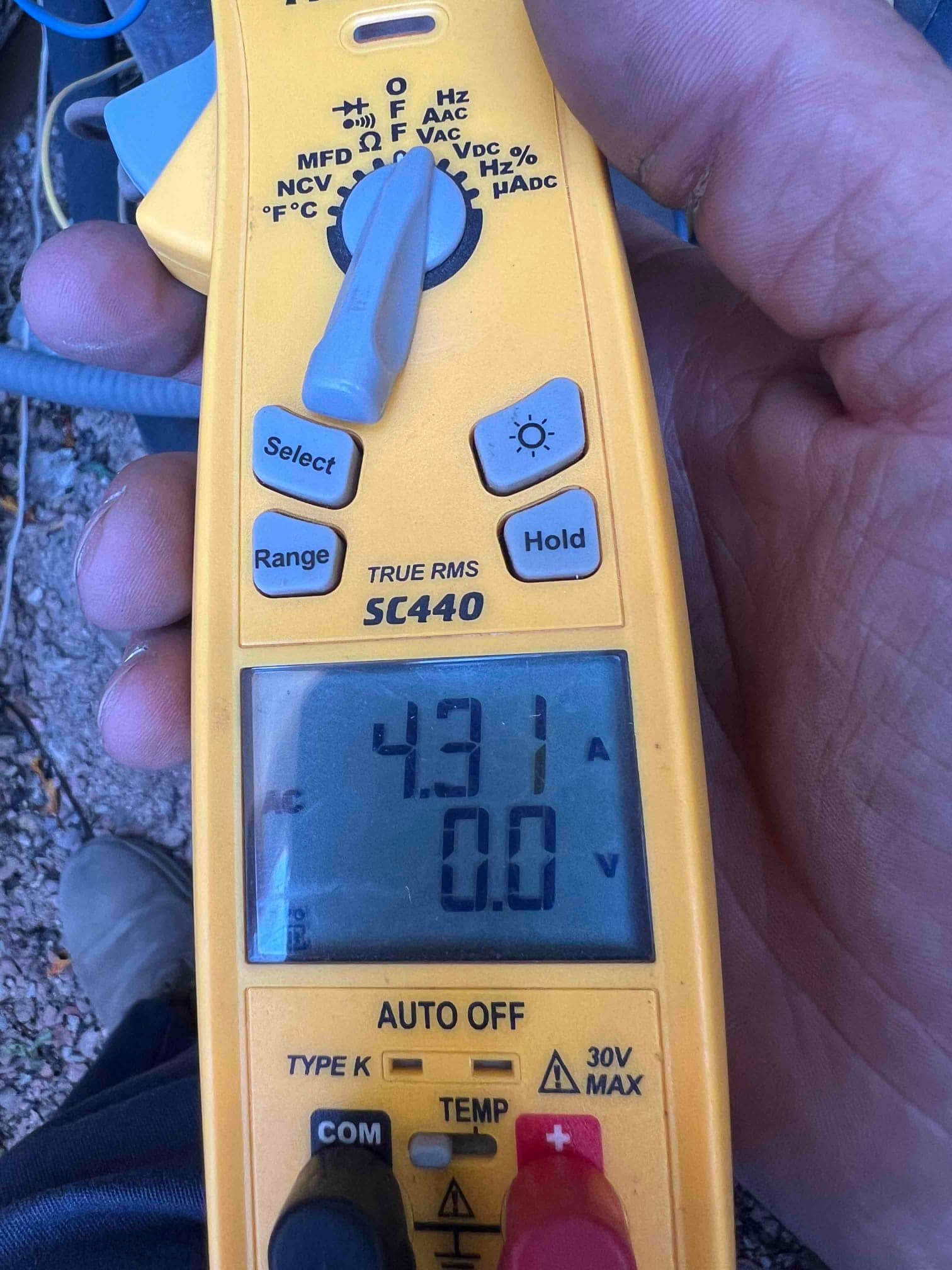 HVAC diagnostic instrument photographed during the service visit.