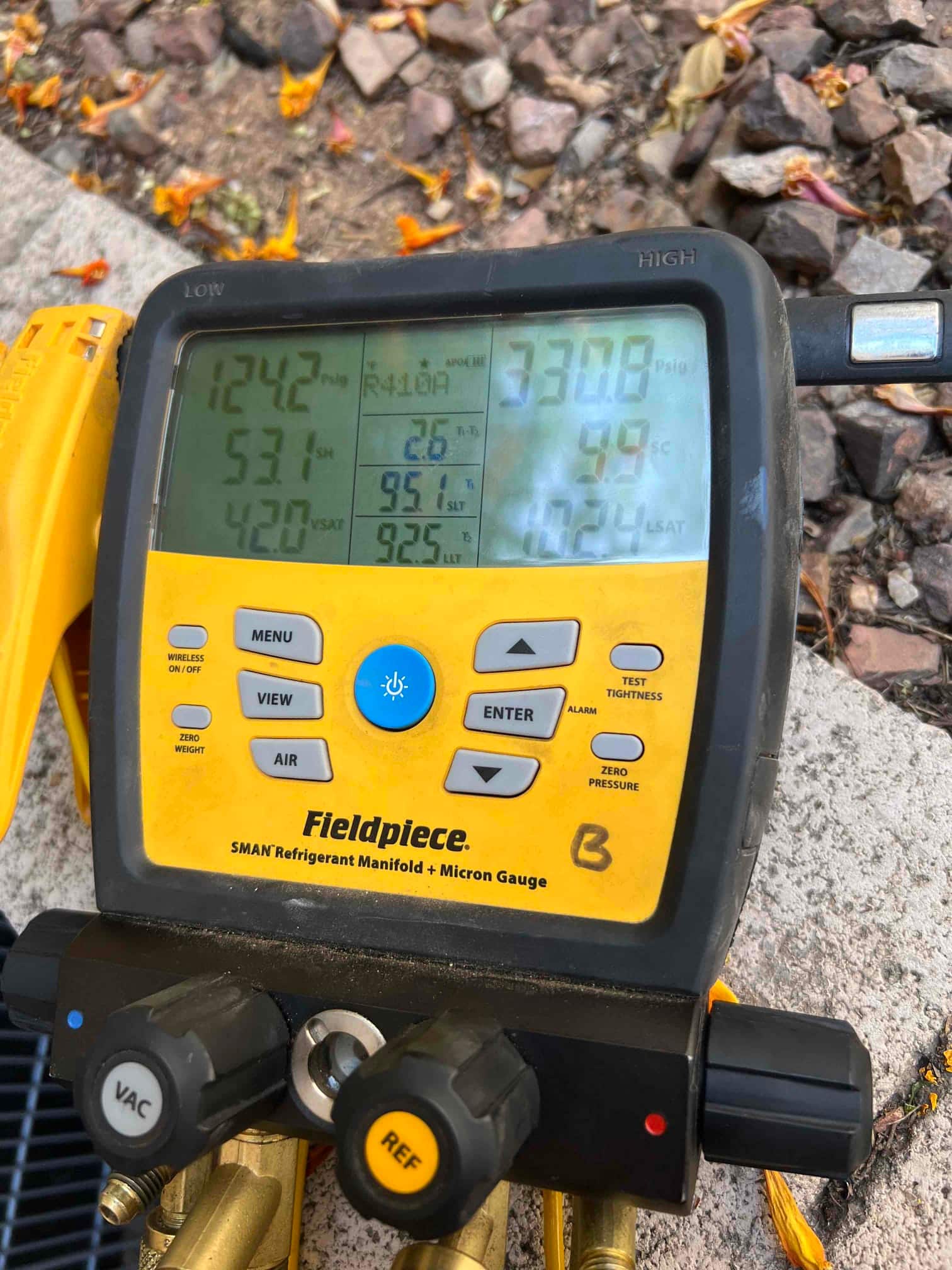 HVAC diagnostic instrument photographed during the service visit.