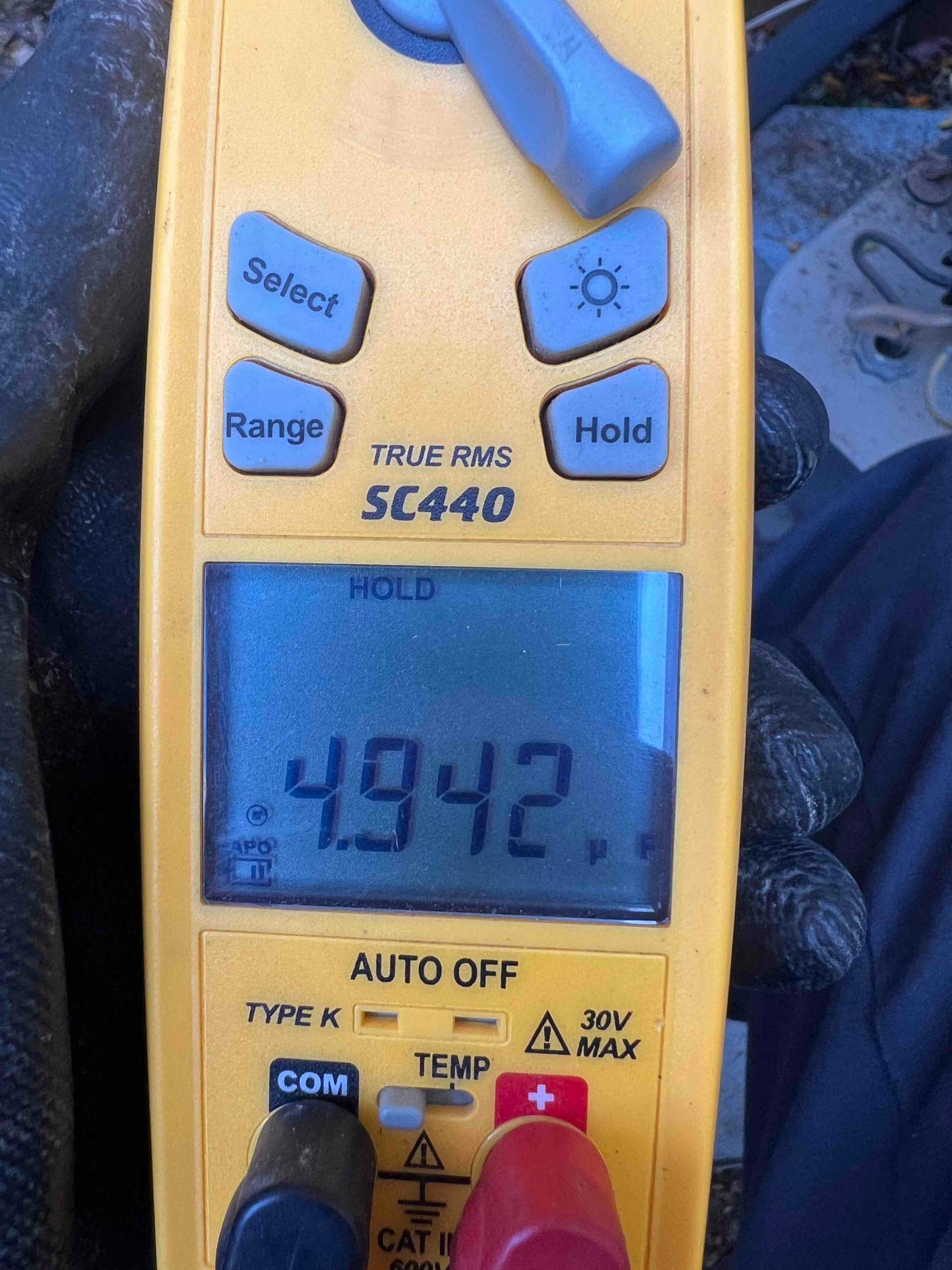 HVAC diagnostic instrument photographed during the service visit.