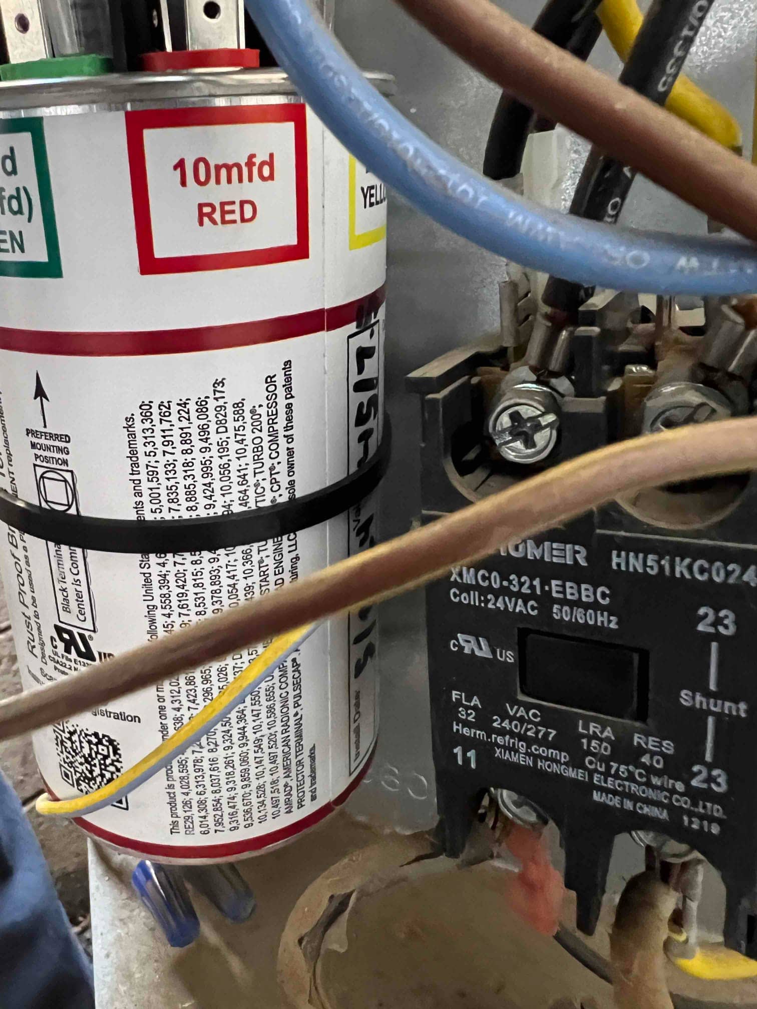 Multi-tap capacitor labeled 10 mfd RED with wiring connected beside a 24 VAC contactor.