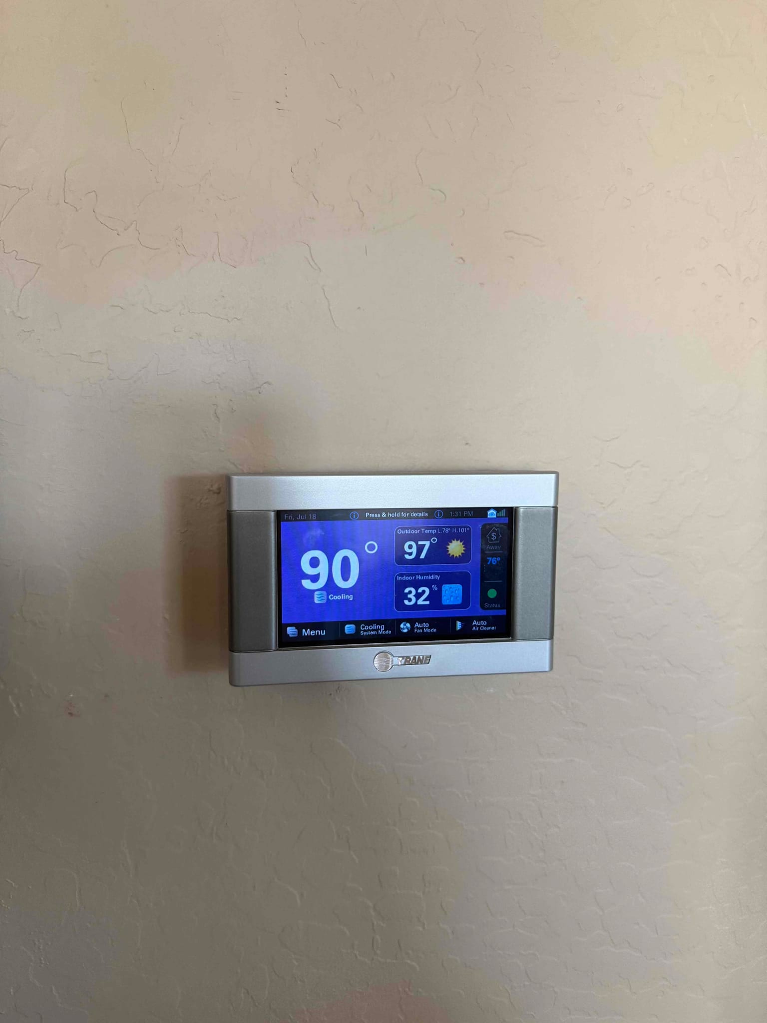 Thermostat display shows 90°, cooling mode active, outdoor temperature 97°, and indoor humidity 32 percent.