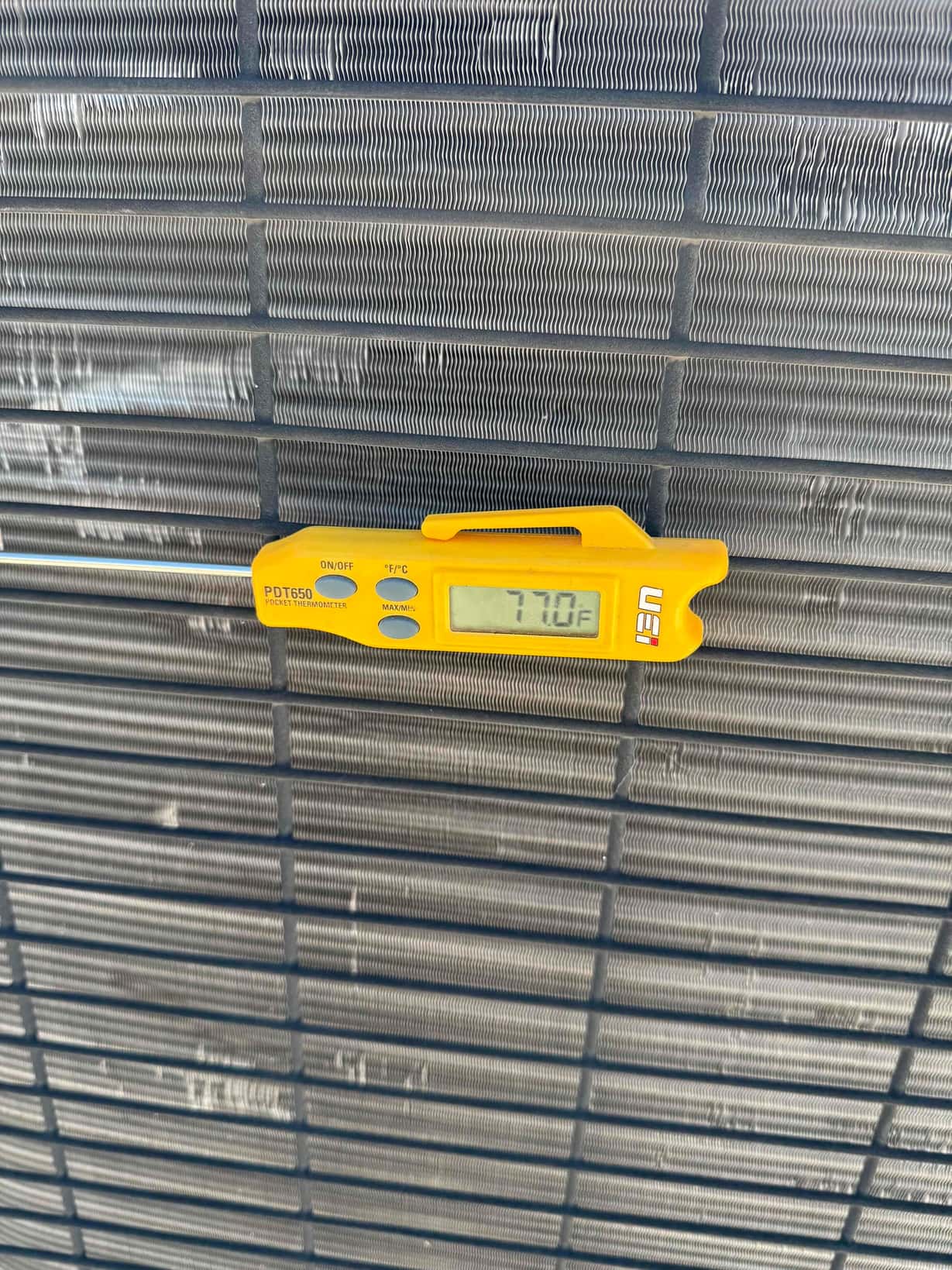 Diagnostic instrument display shows 77 °F.