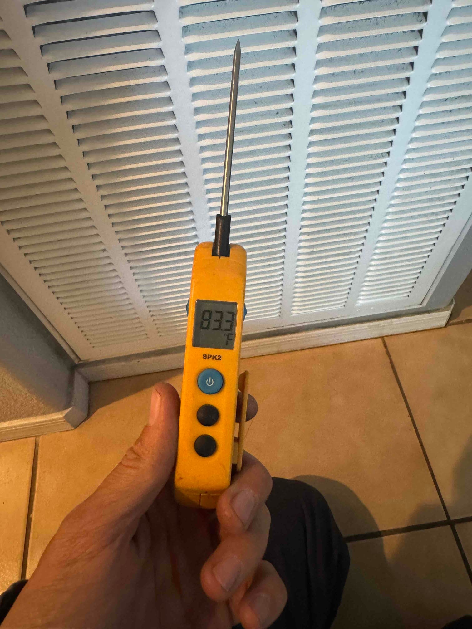 HVAC diagnostic instrument photographed during the service visit.