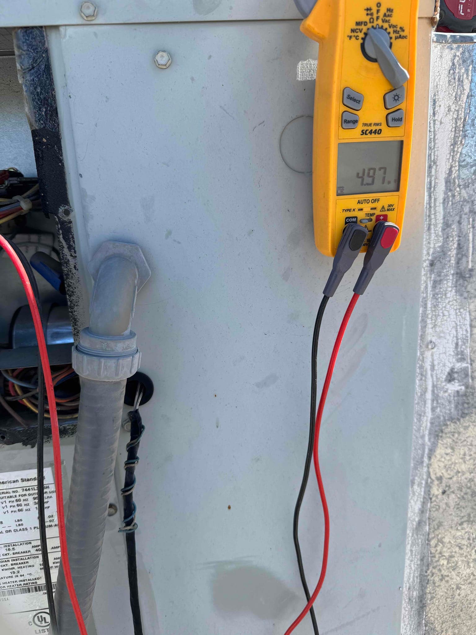 HVAC diagnostic instrument photographed during the service visit.