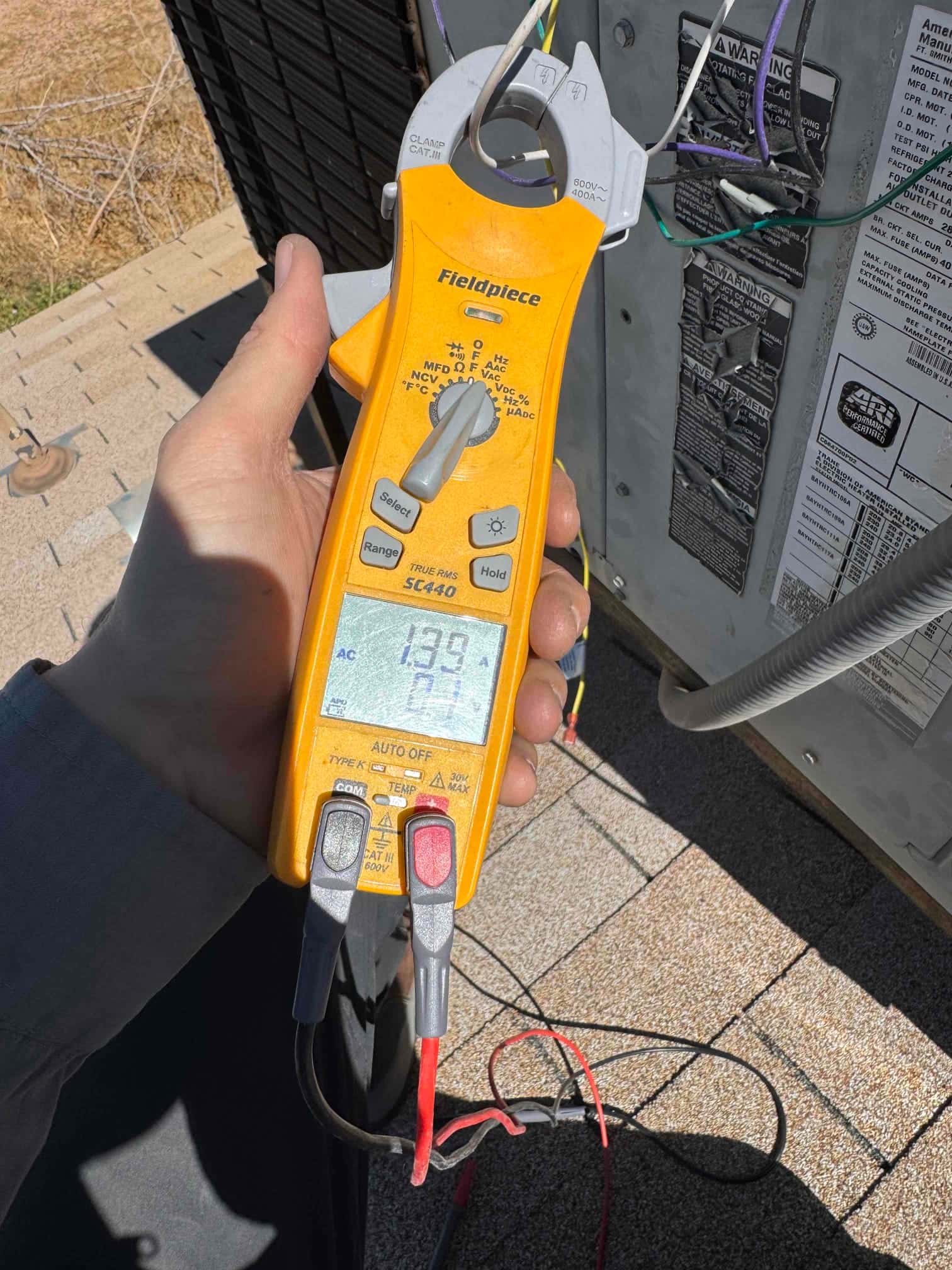 HVAC diagnostic instrument photographed during the service visit.