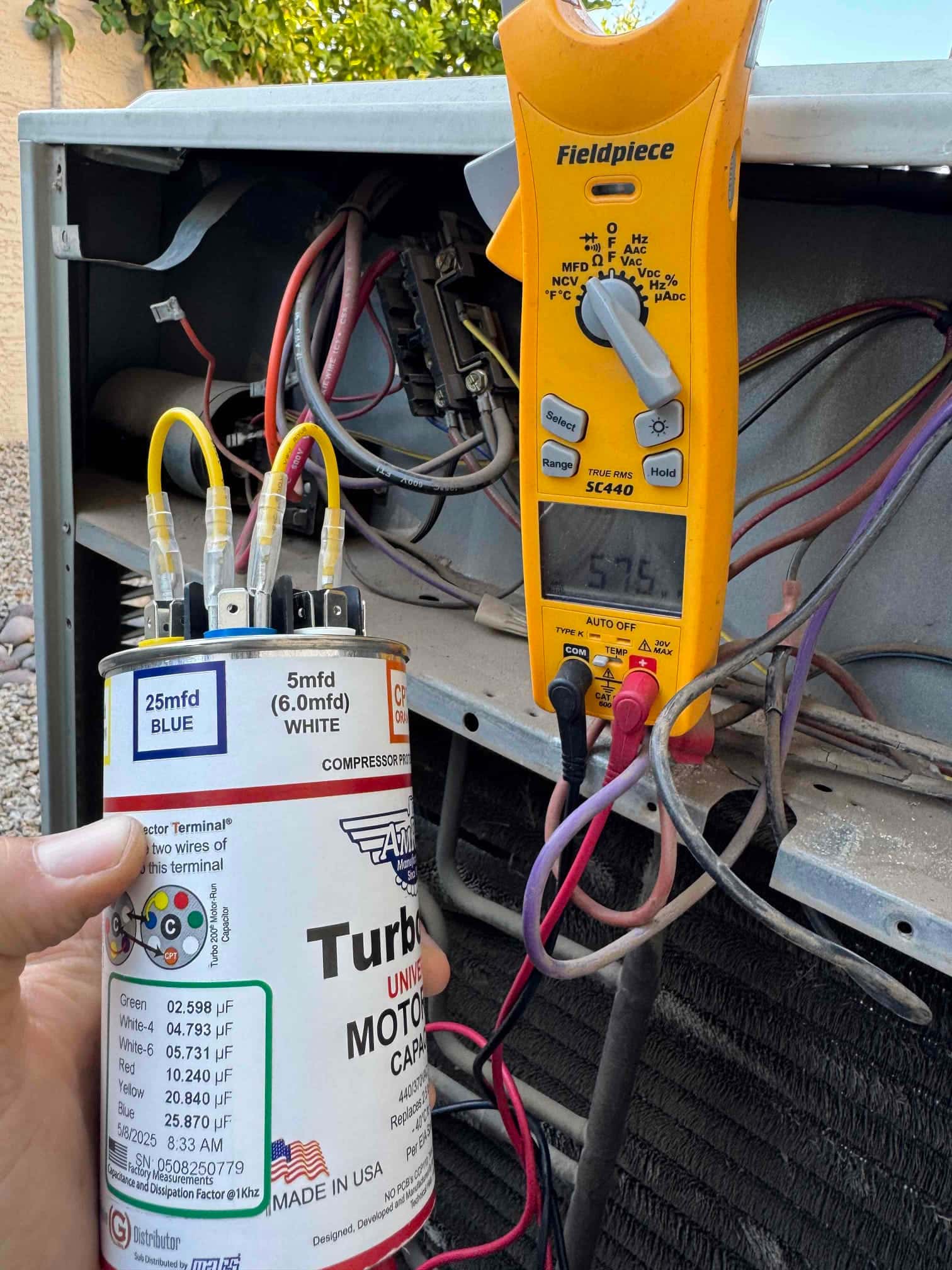 Diagnostic instrument display shows 57.6 μF.