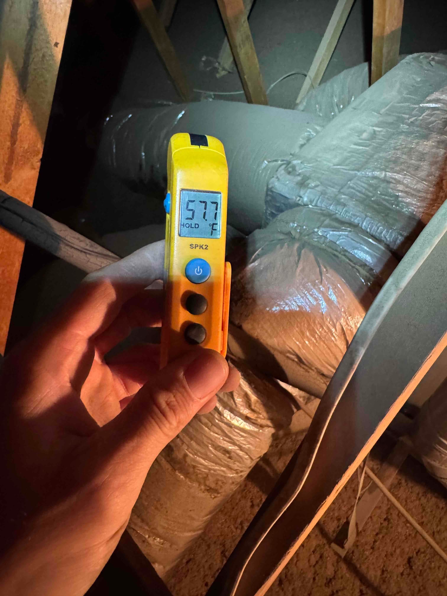 Diagnostic instrument display shows 57.7 °F.