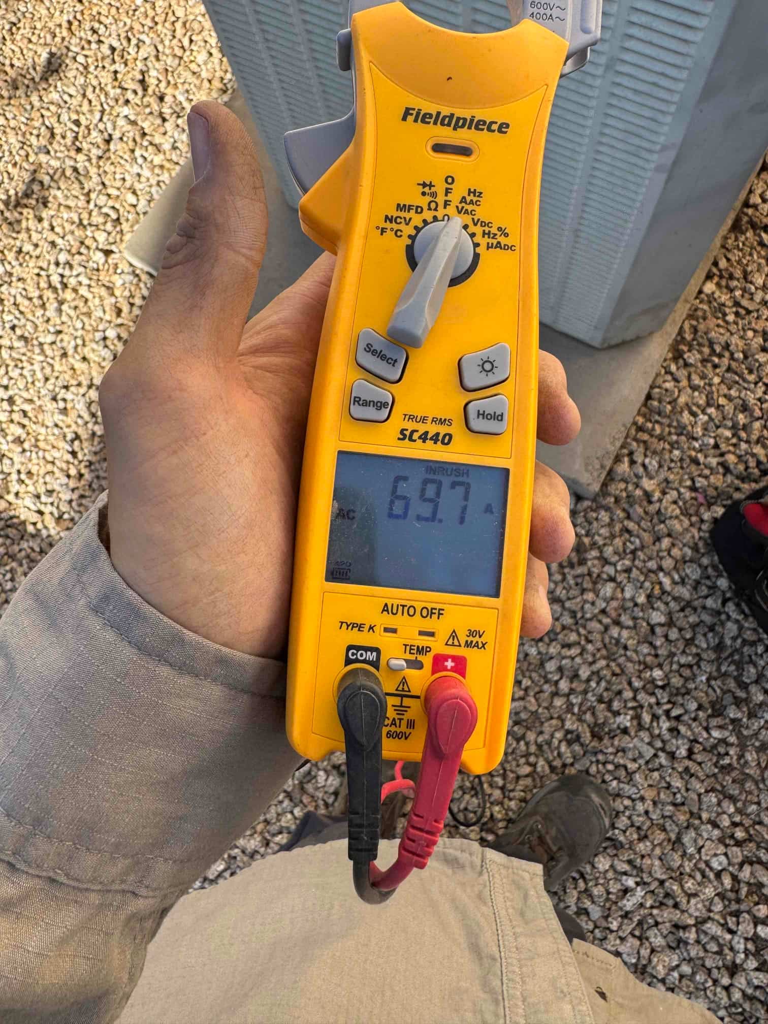Diagnostic instrument display shows 69.7 A.
