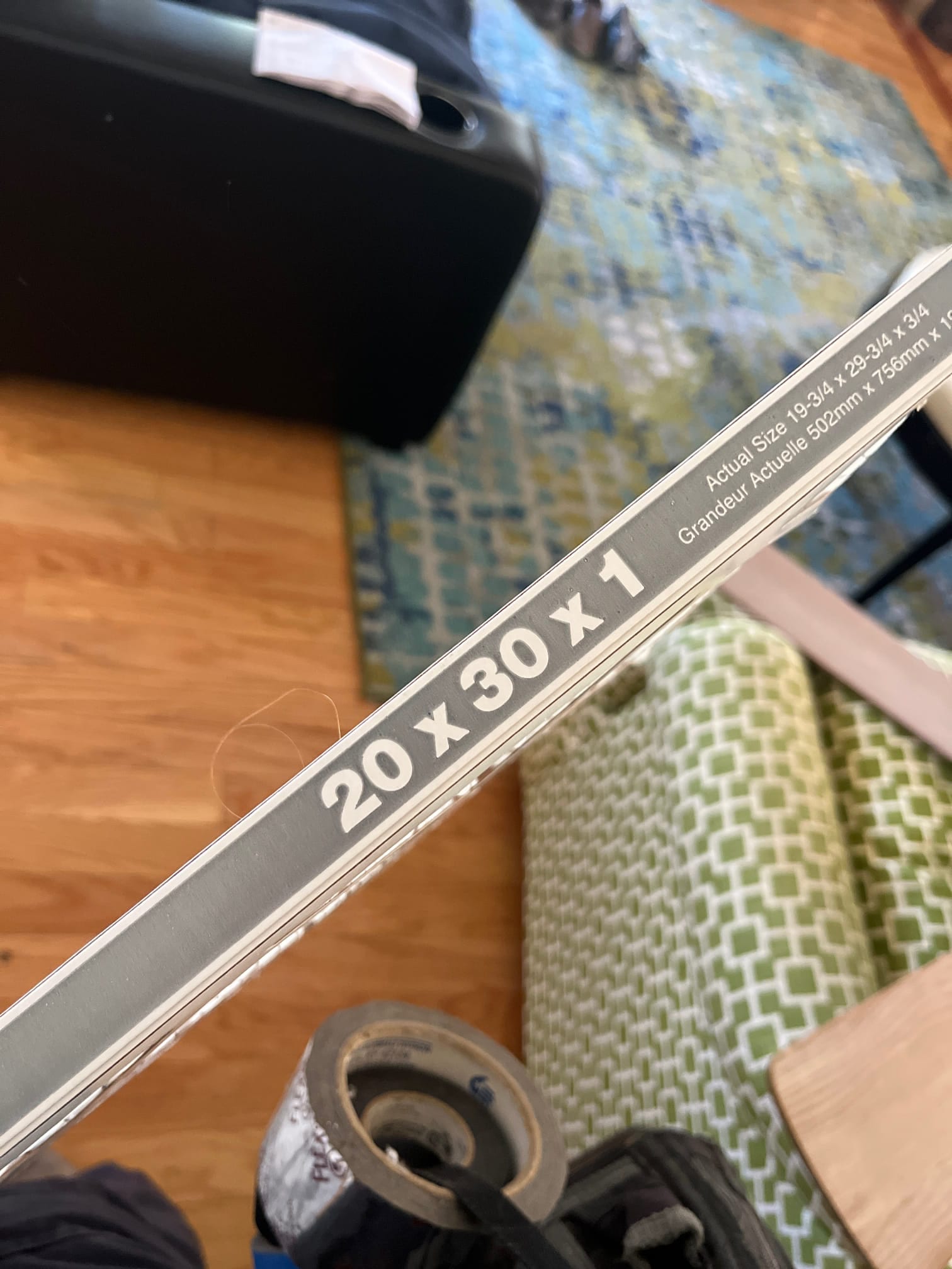 Disposable HVAC air filter edge shows printed size 20 x 30 x 1.