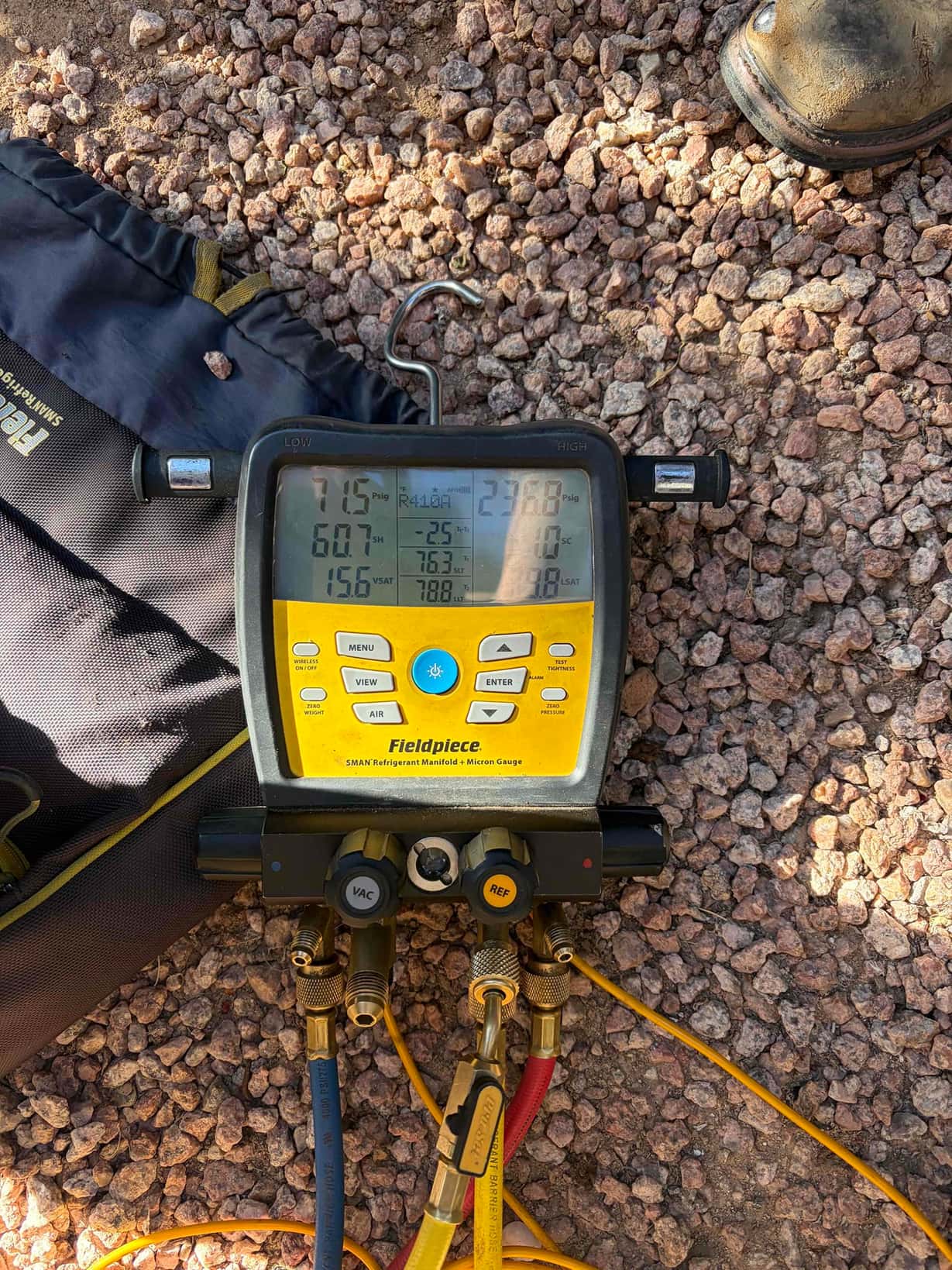 HVAC diagnostic instrument photographed during the service visit.