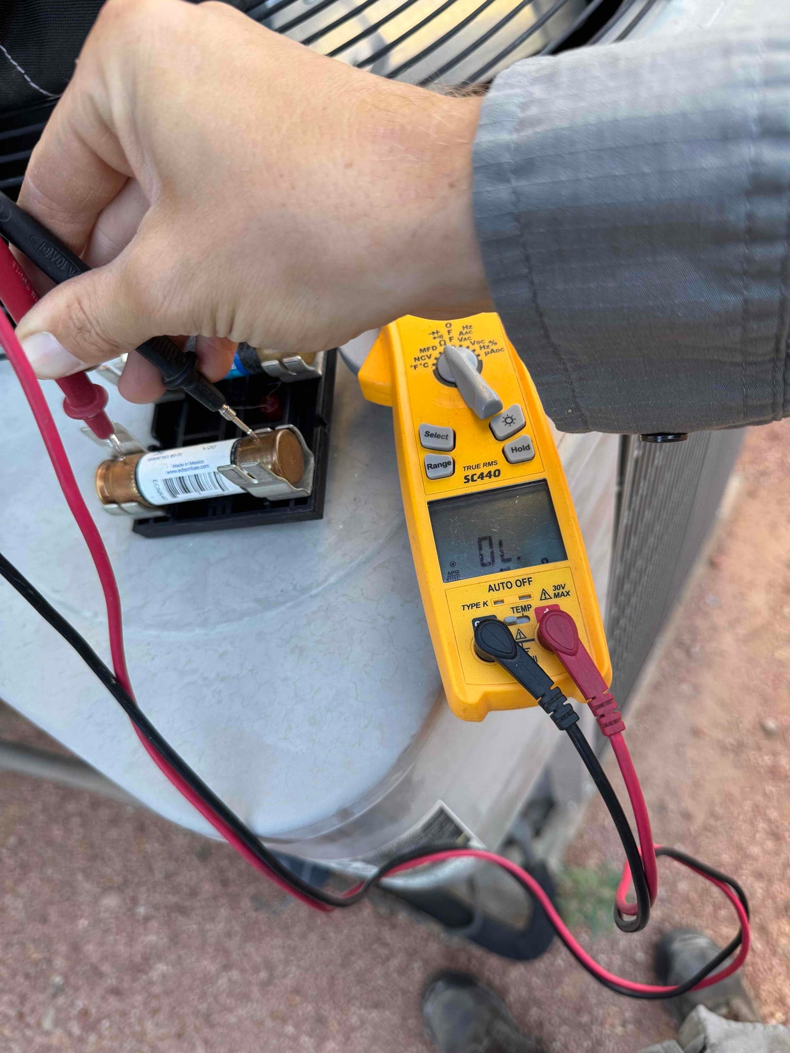 HVAC diagnostic instrument photographed during the service visit.