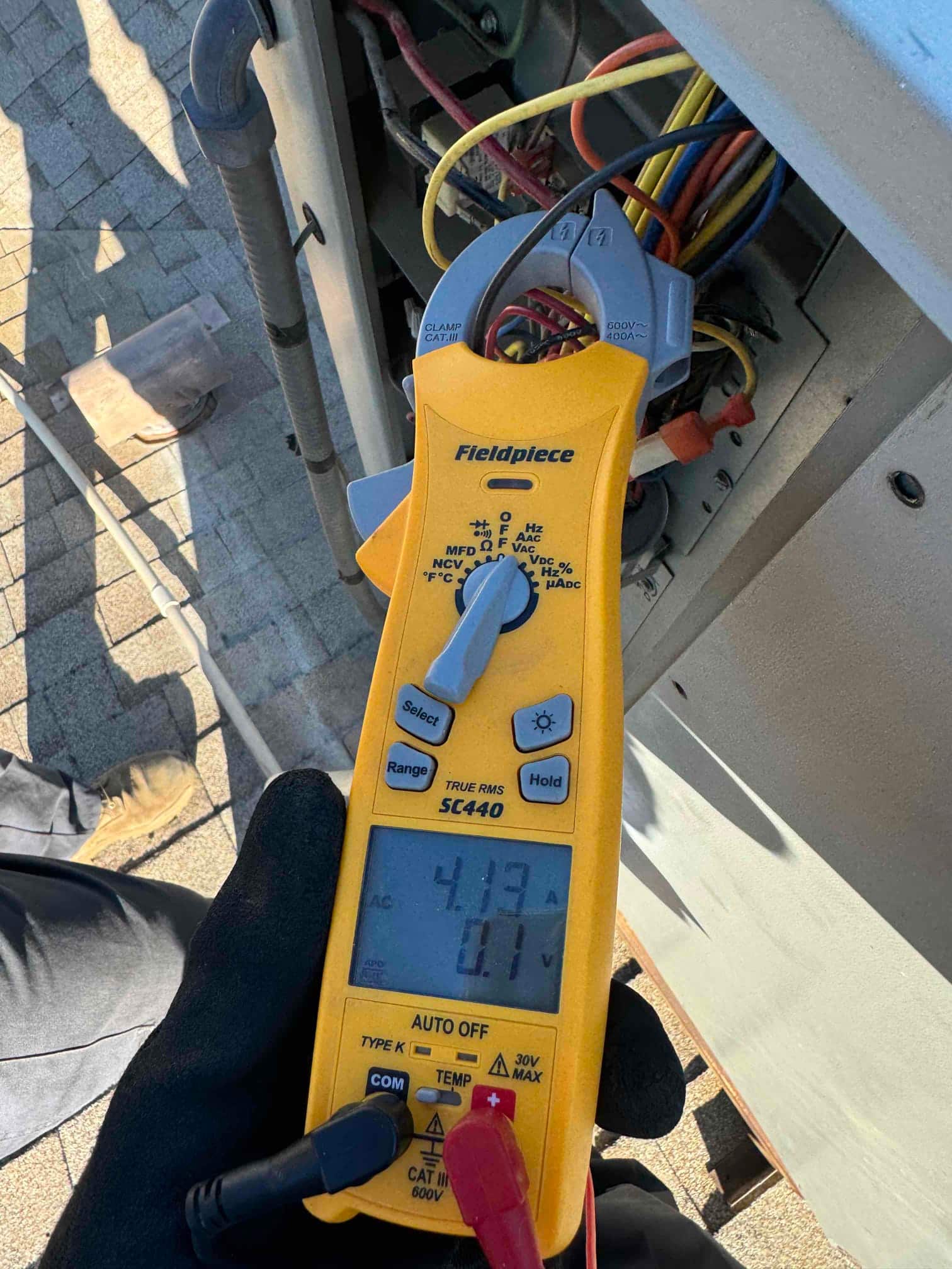 HVAC diagnostic instrument photographed during the service visit.