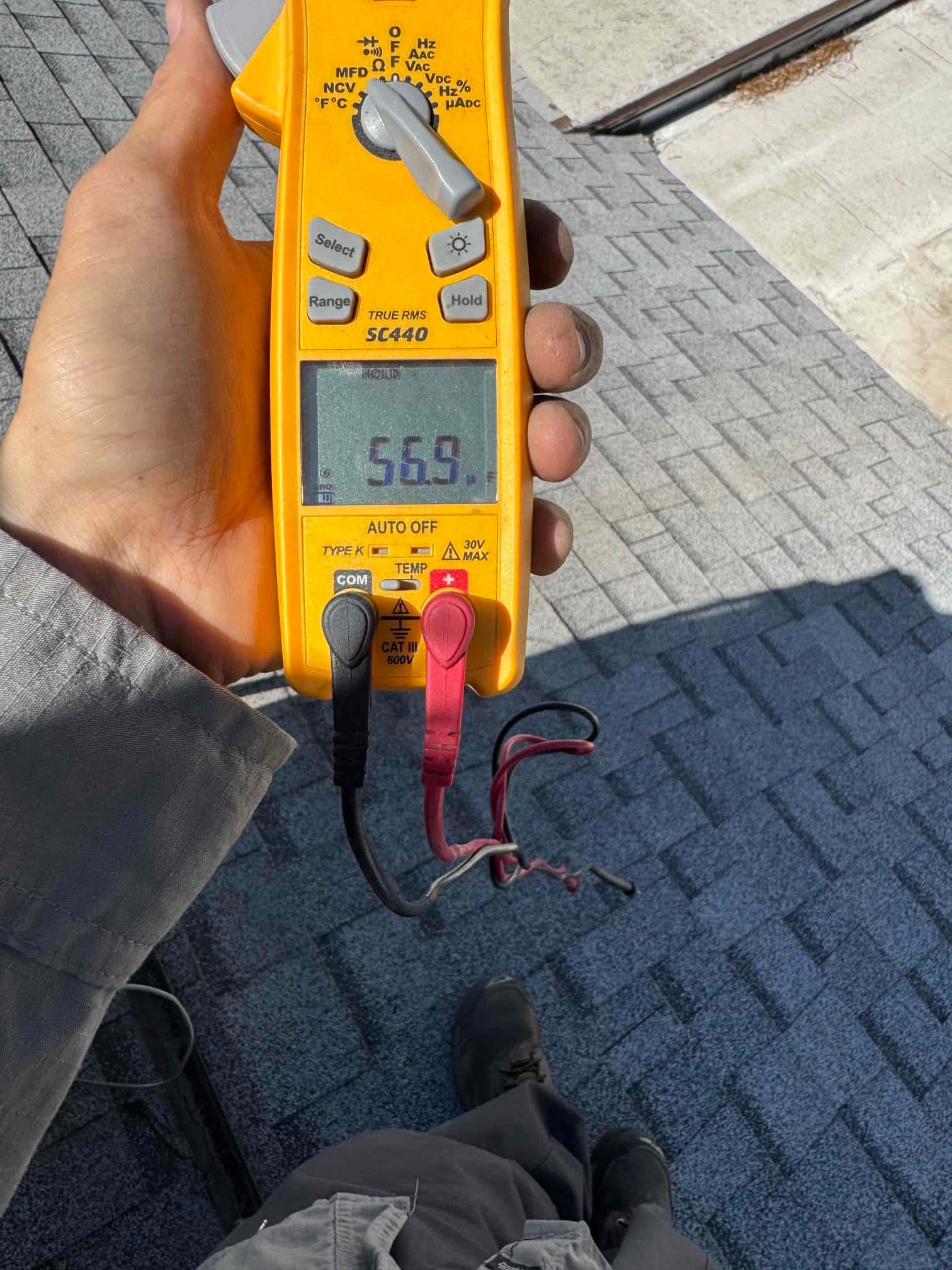 HVAC diagnostic instrument photographed during the service visit.