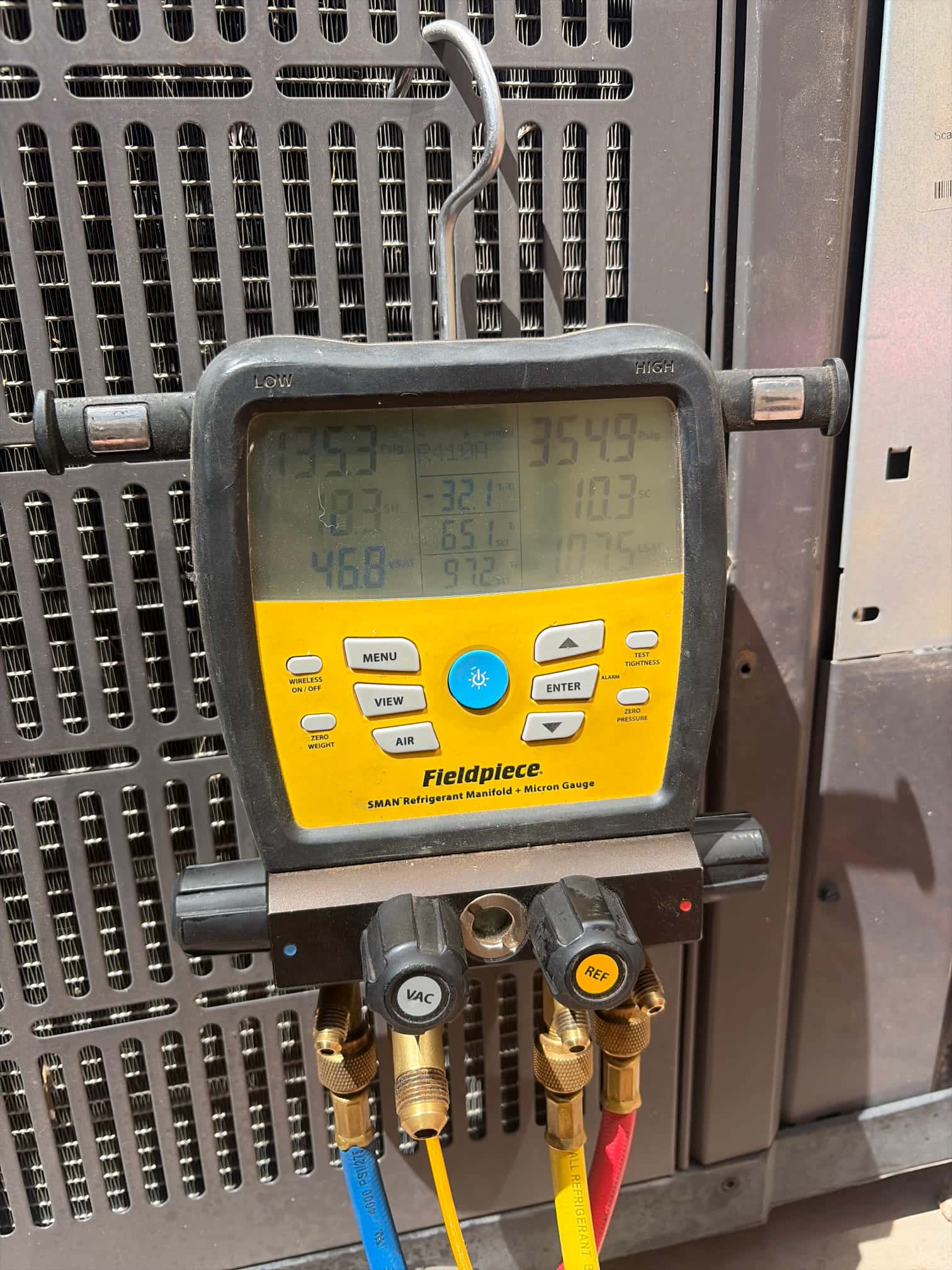 HVAC diagnostic instrument photographed during the service visit.
