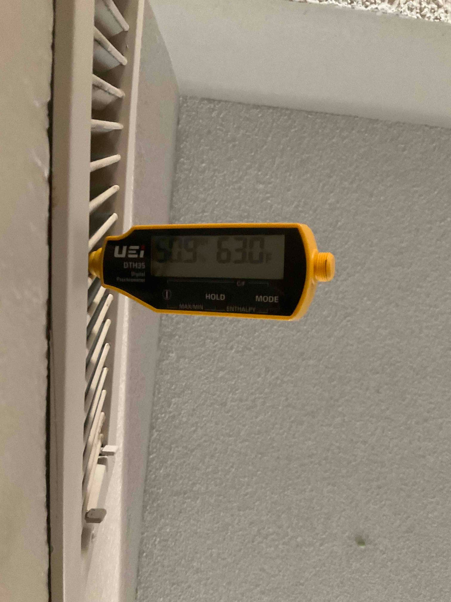 HVAC diagnostic instrument photographed during the service visit.