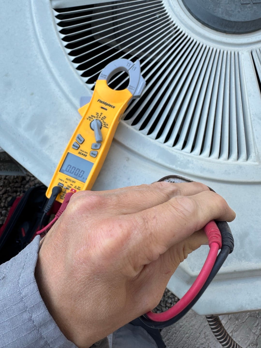 HVAC diagnostic instrument photographed during the service visit.