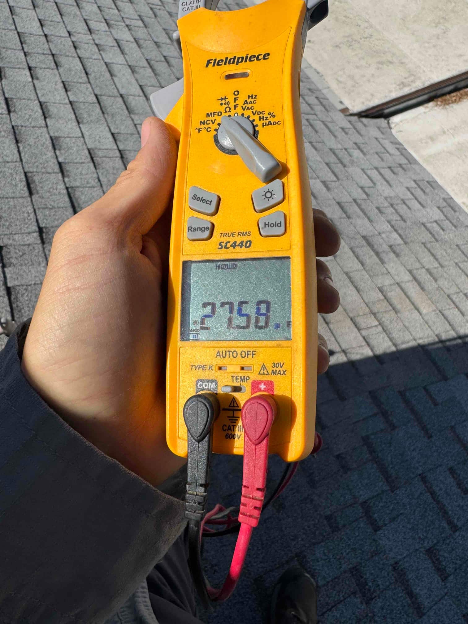 HVAC diagnostic instrument photographed during the service visit.