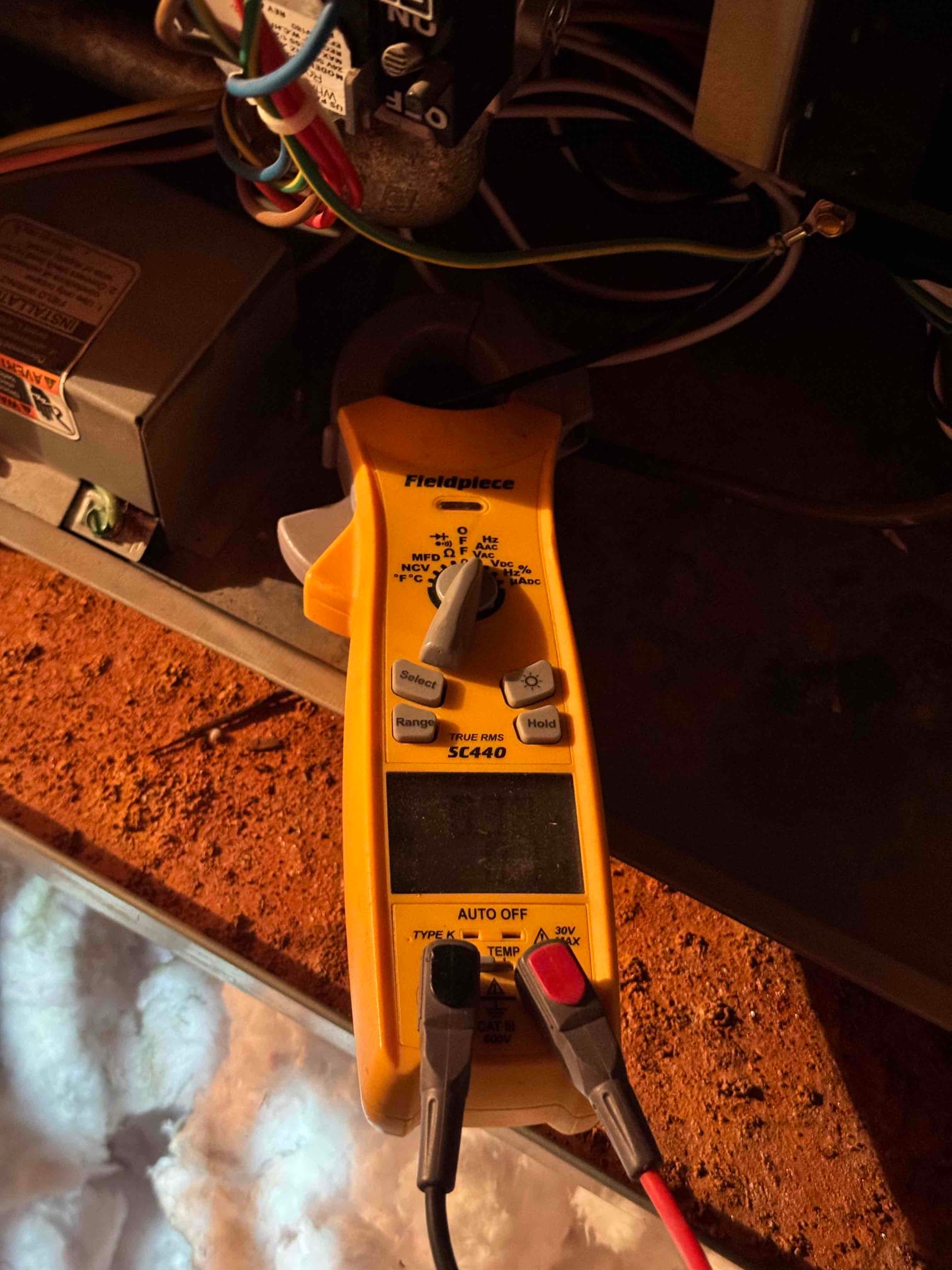HVAC diagnostic instrument photographed during the service visit.