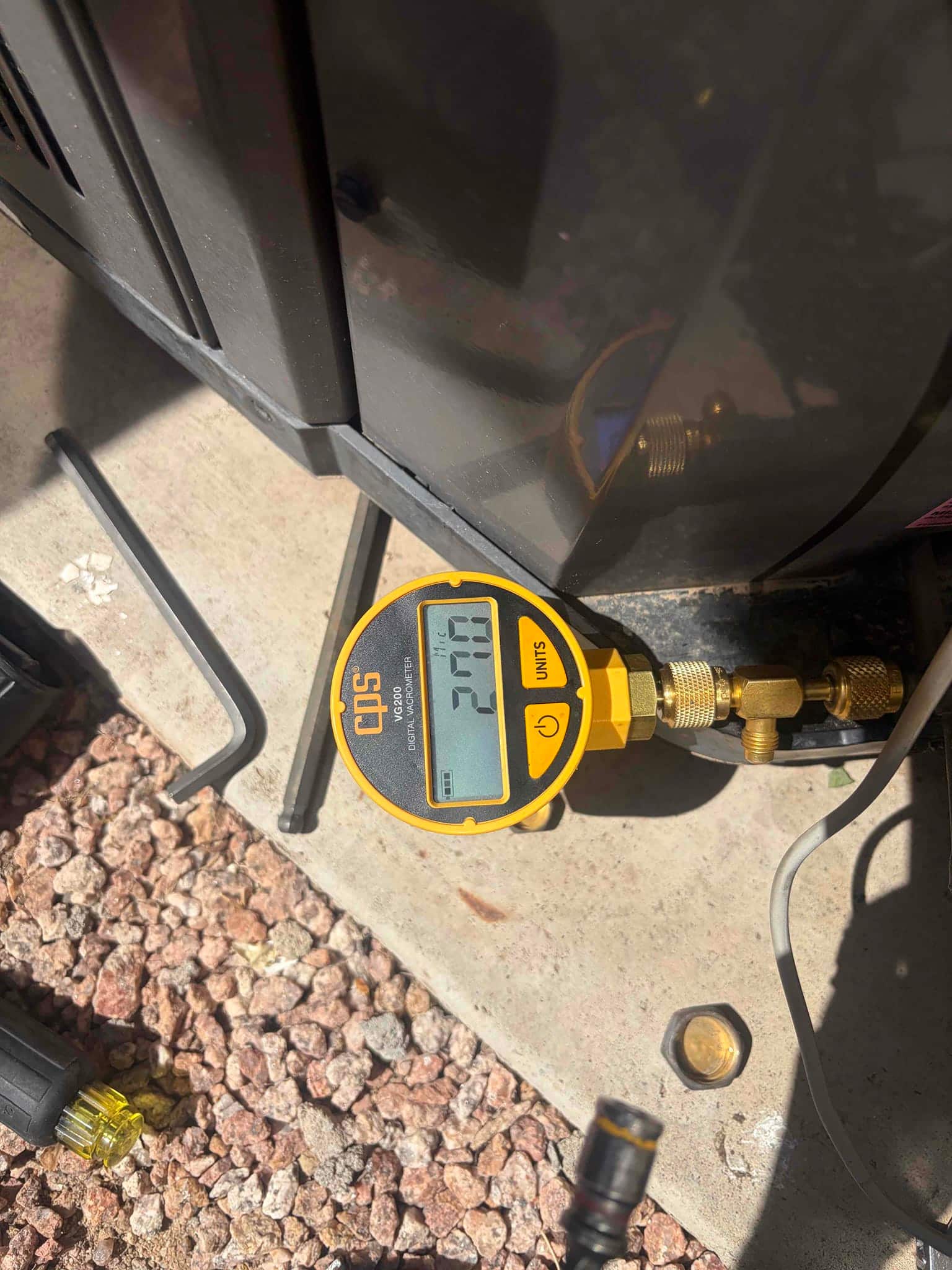 HVAC diagnostic instrument photographed during the service visit.