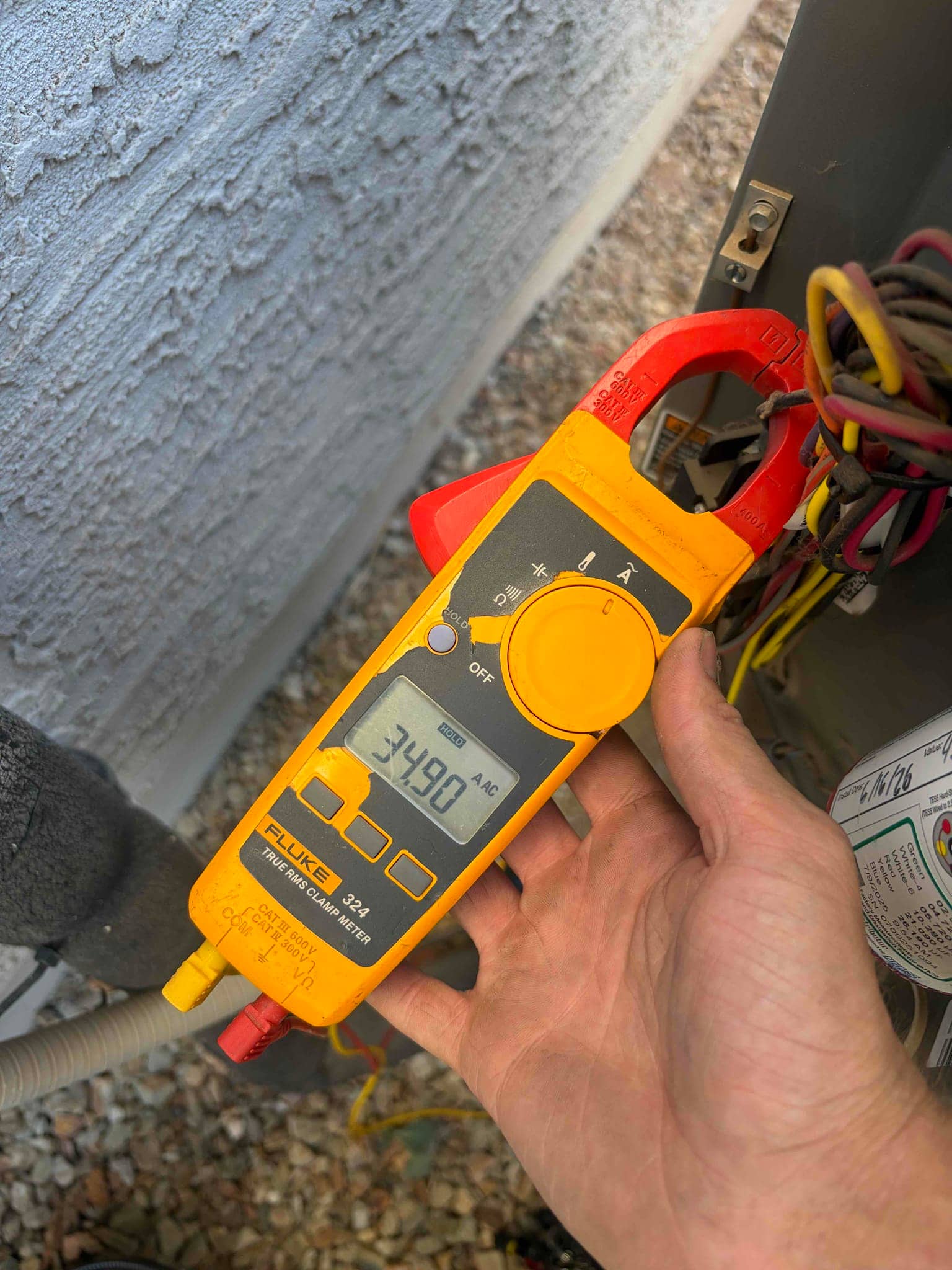 HVAC diagnostic instrument photographed during the service visit.