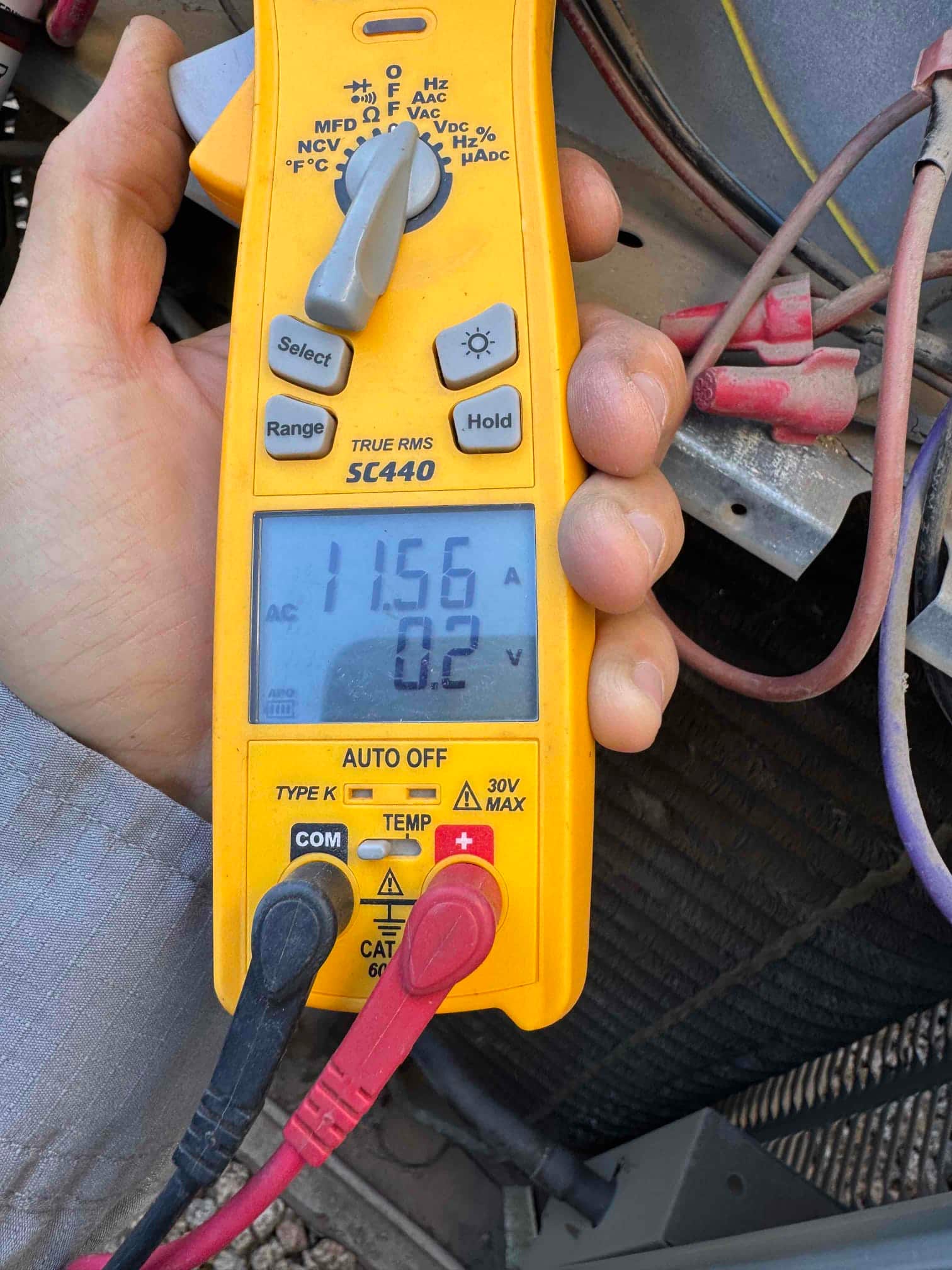 HVAC diagnostic instrument photographed during the service visit.