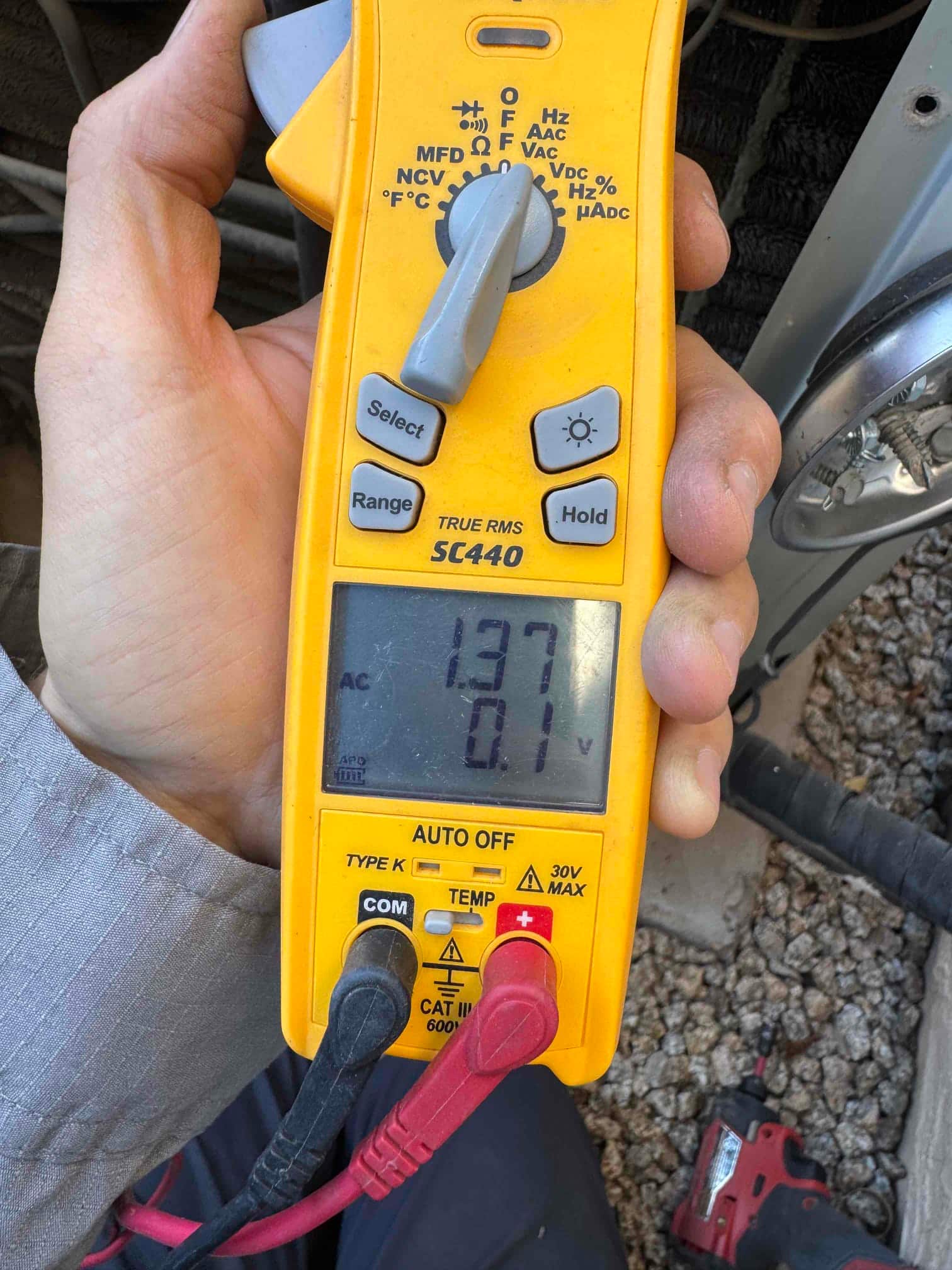 HVAC diagnostic instrument photographed during the service visit.