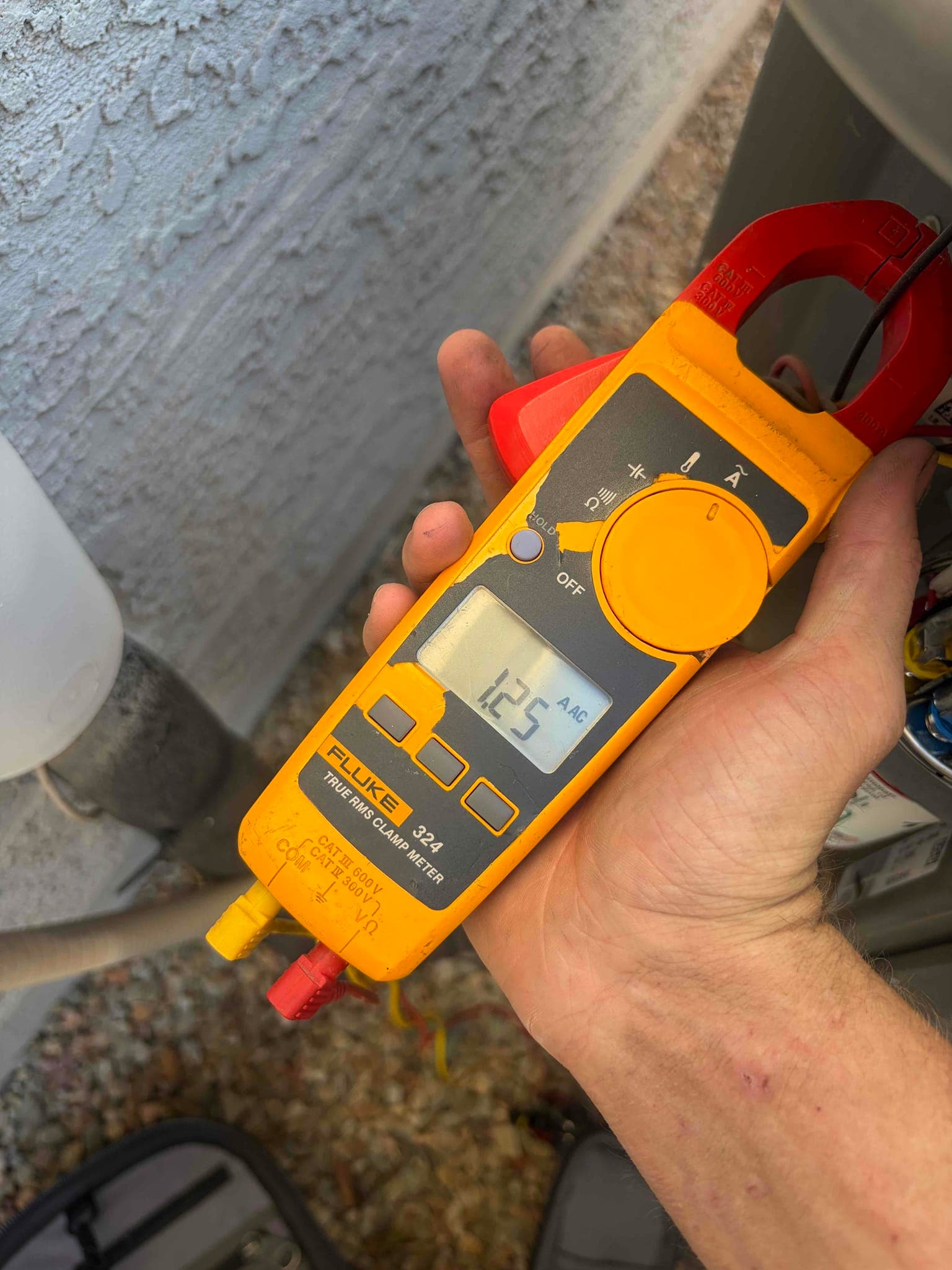 HVAC diagnostic instrument photographed during the service visit.