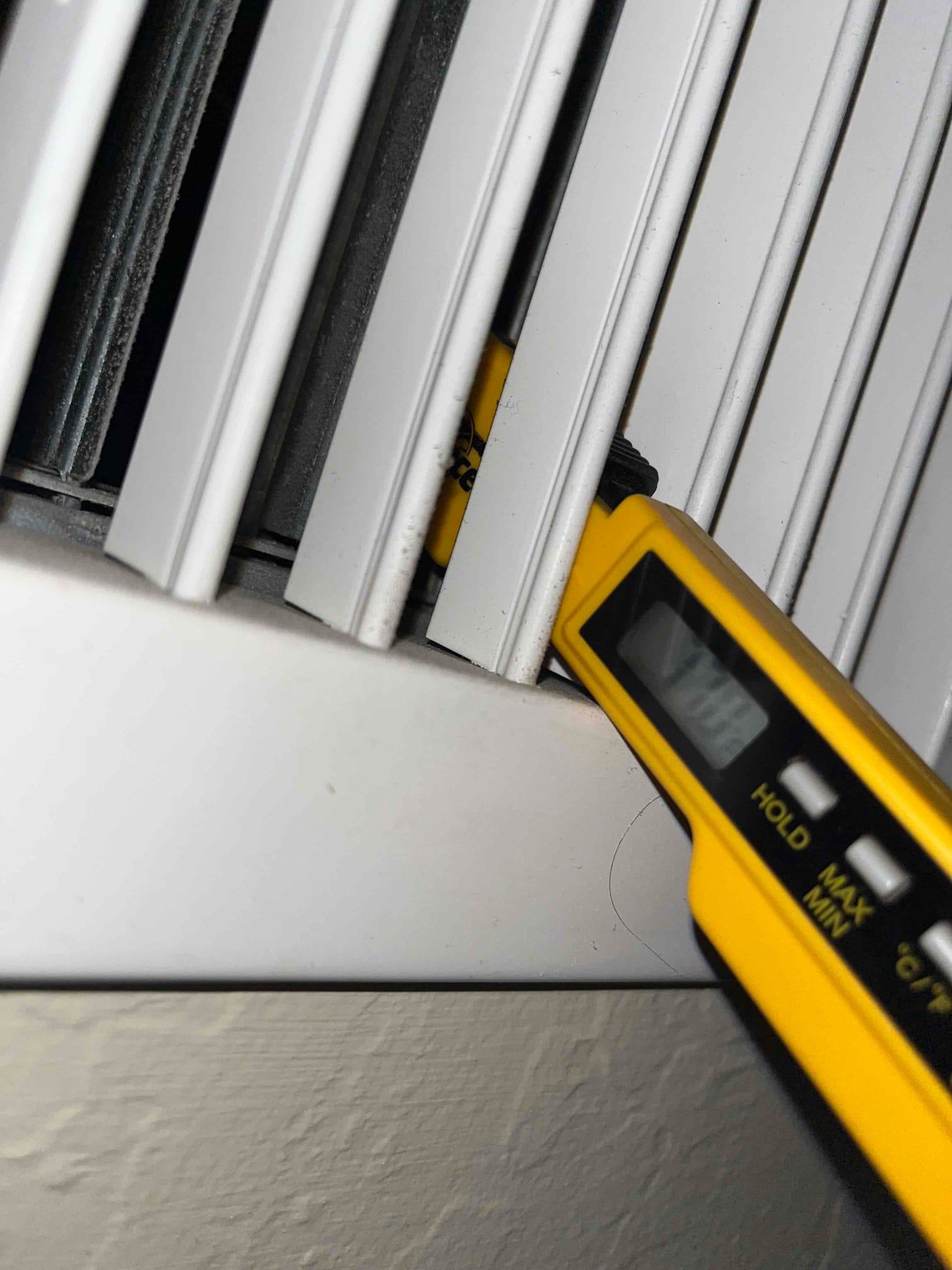 HVAC diagnostic instrument photographed during the service visit.