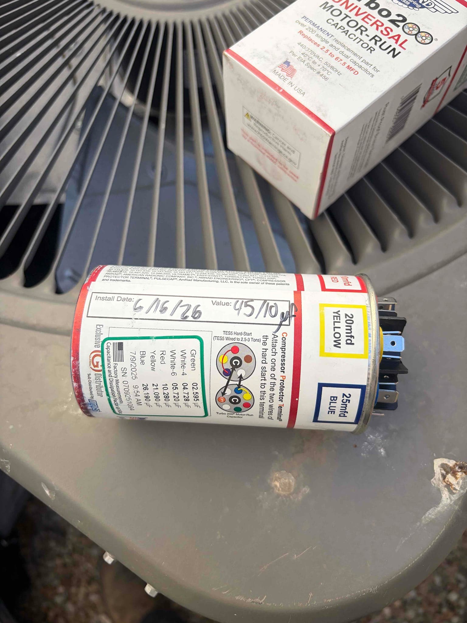 Universal motor run capacitor with labeled terminals and color chart; side label shows 20 mfd YELLOW and 25 mfd BLUE.