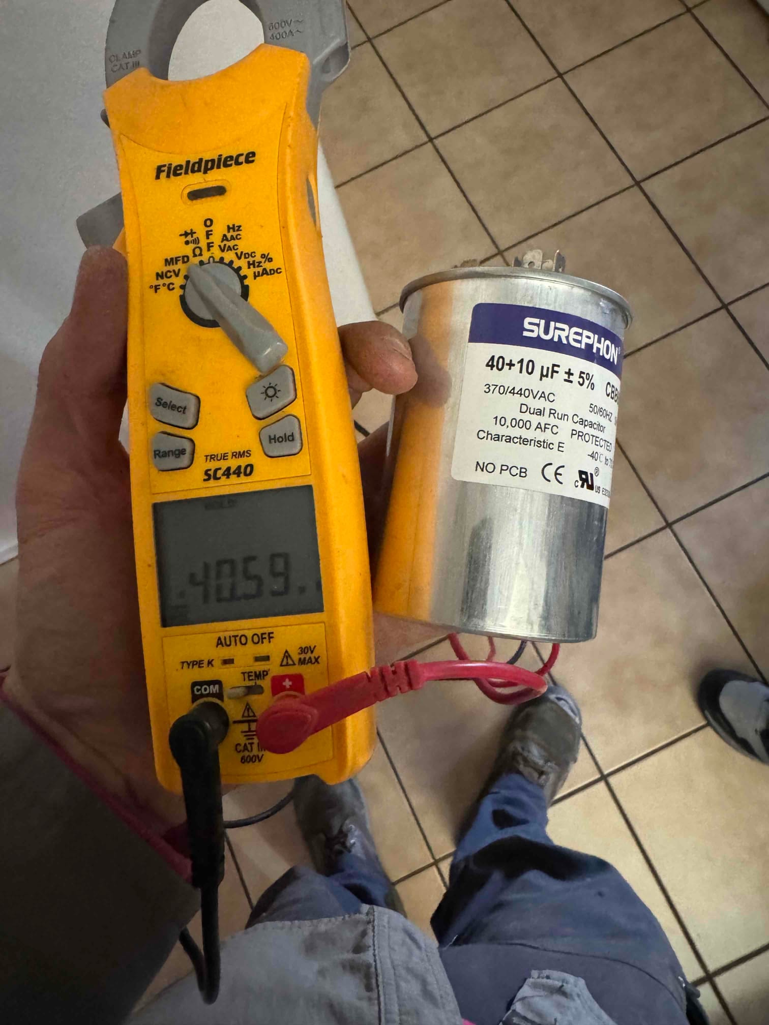 HVAC diagnostic instrument photographed during the service visit.
