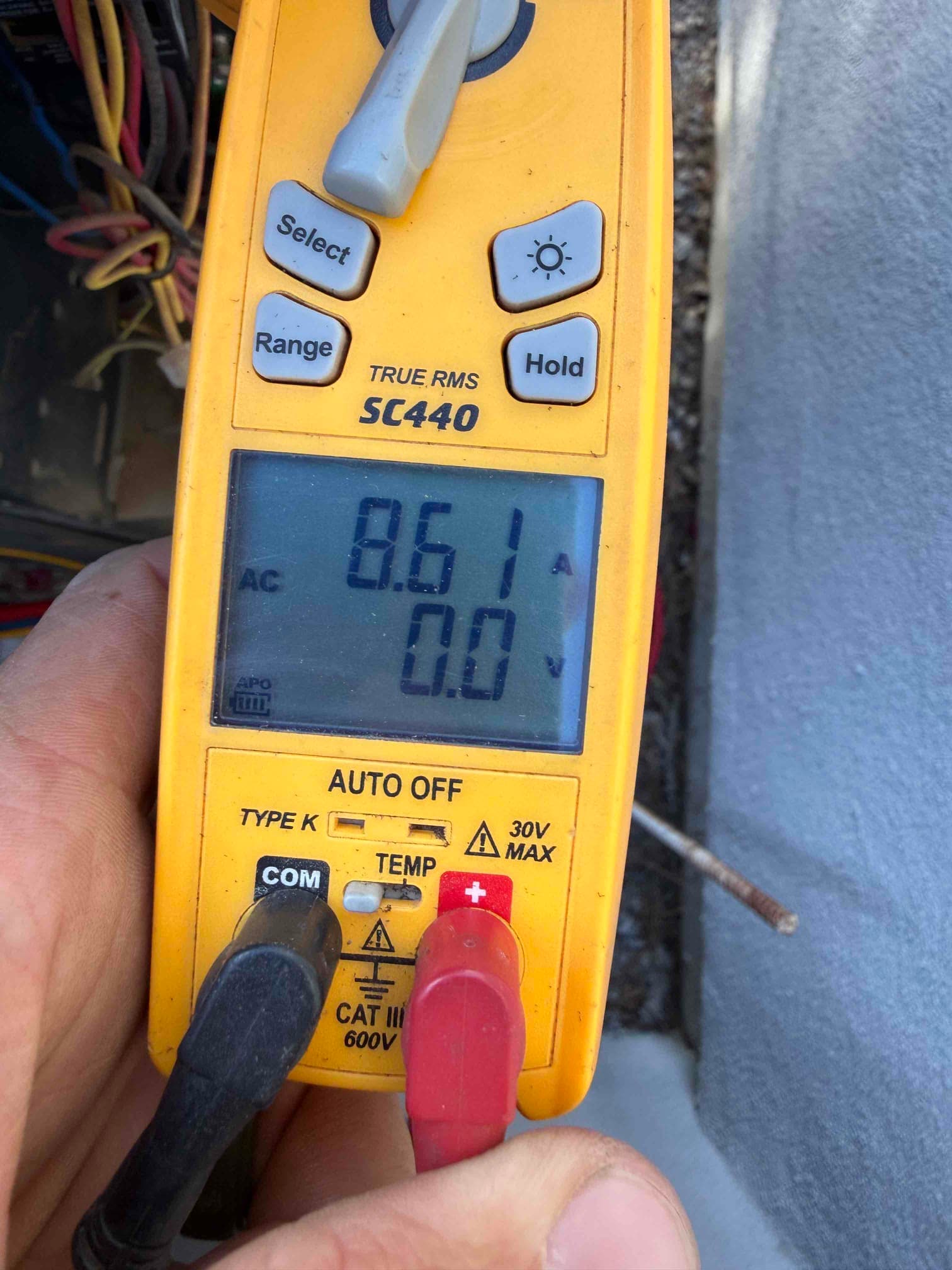 Diagnostic instrument display shows 8.61 A.