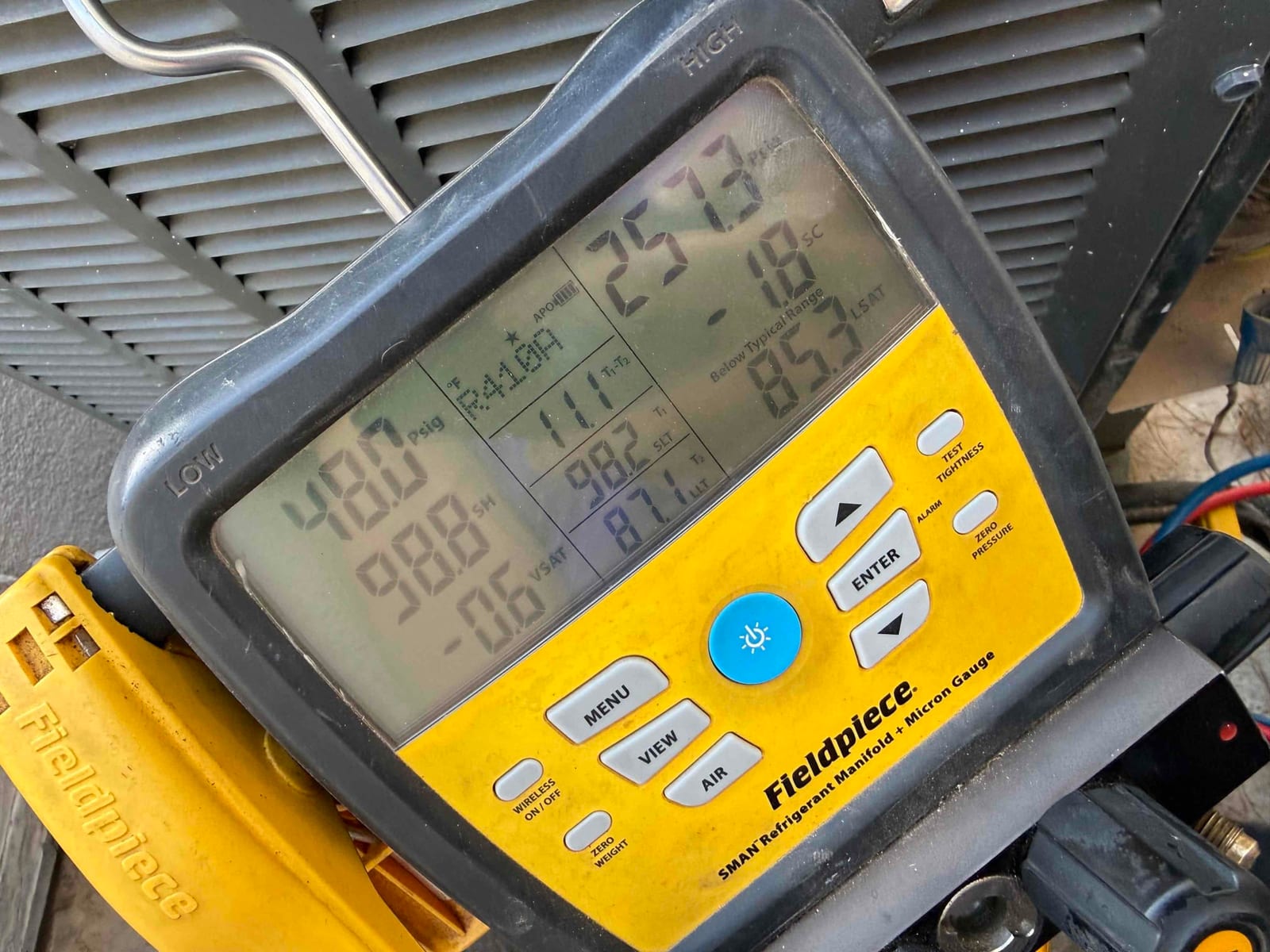 HVAC diagnostic instrument photographed during the service visit.