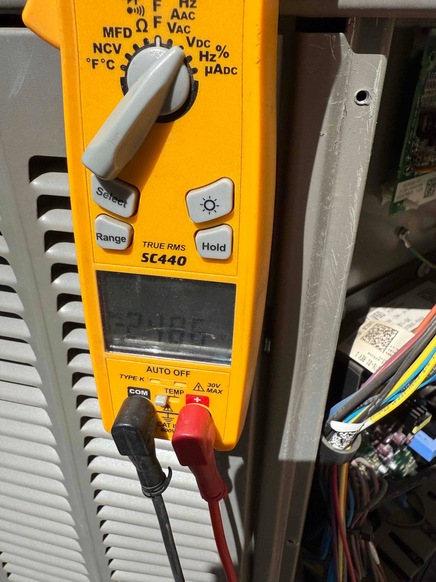 HVAC diagnostic instrument photographed during the service visit.