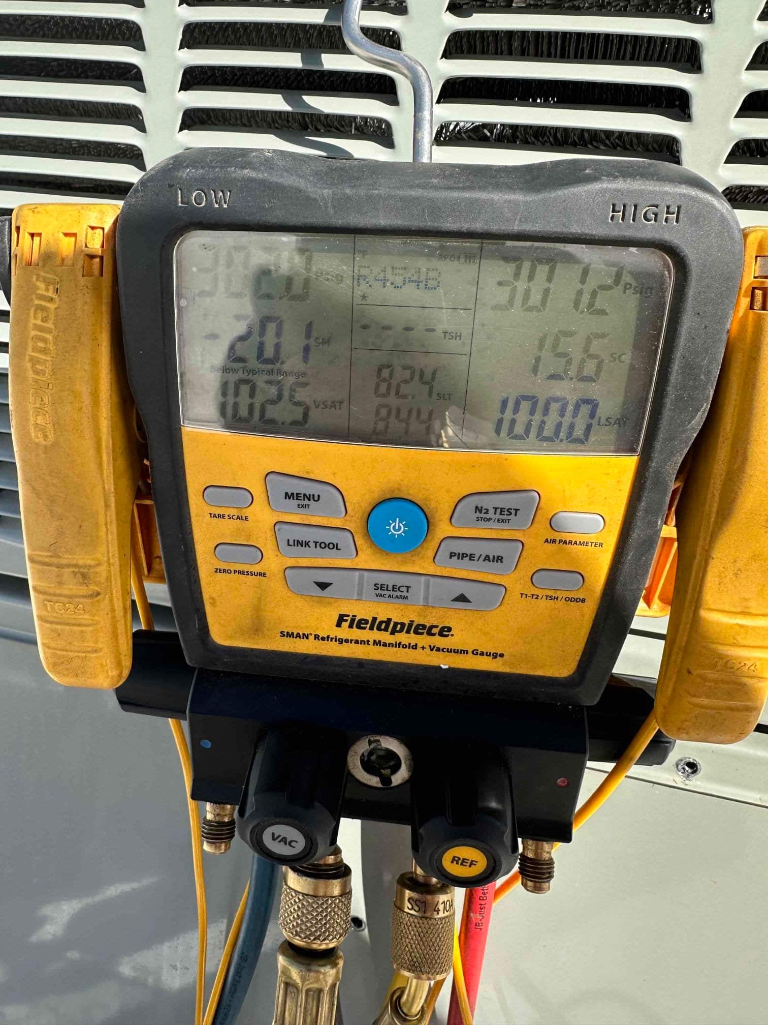 HVAC diagnostic instrument photographed during the service visit.