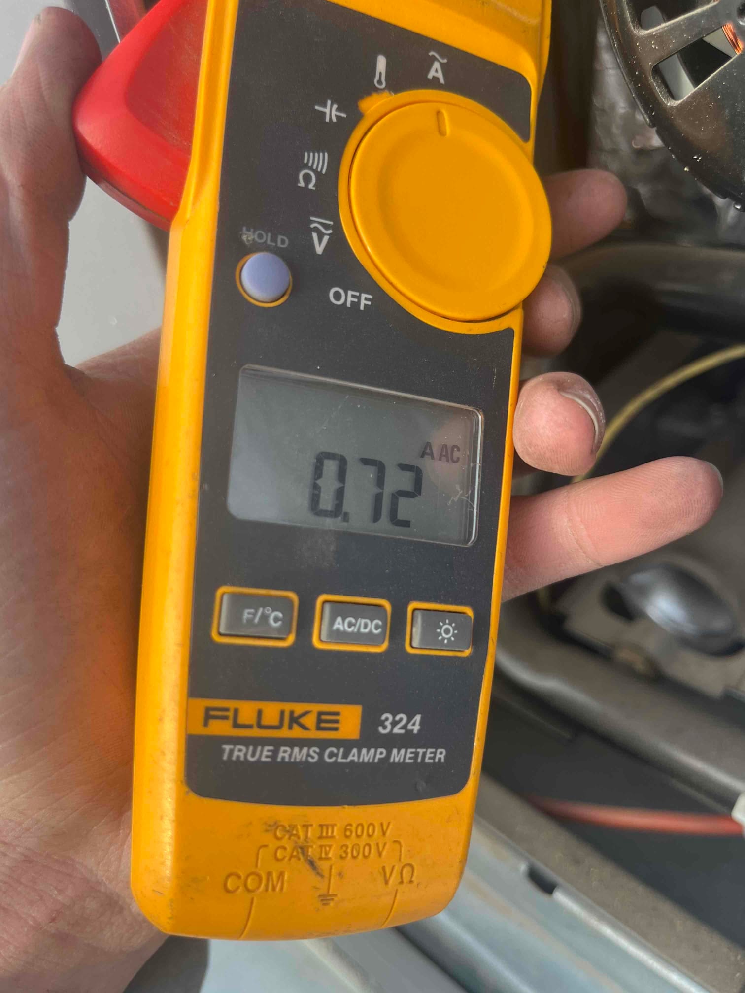 Diagnostic instrument display shows 0.72 A.