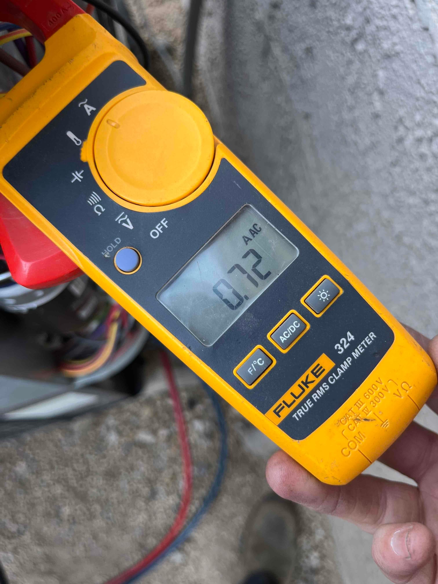 Diagnostic instrument display shows 0.72 A.