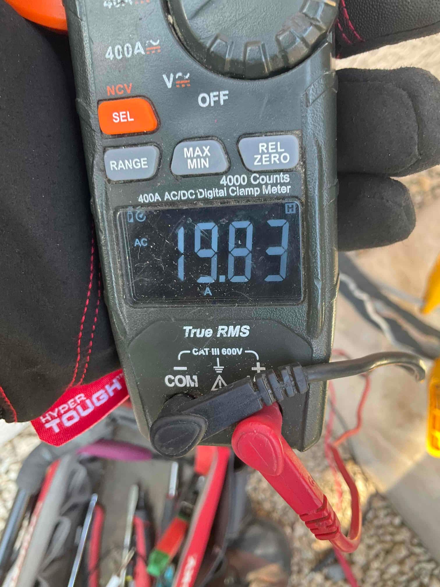 Diagnostic instrument display shows 19.83 A.