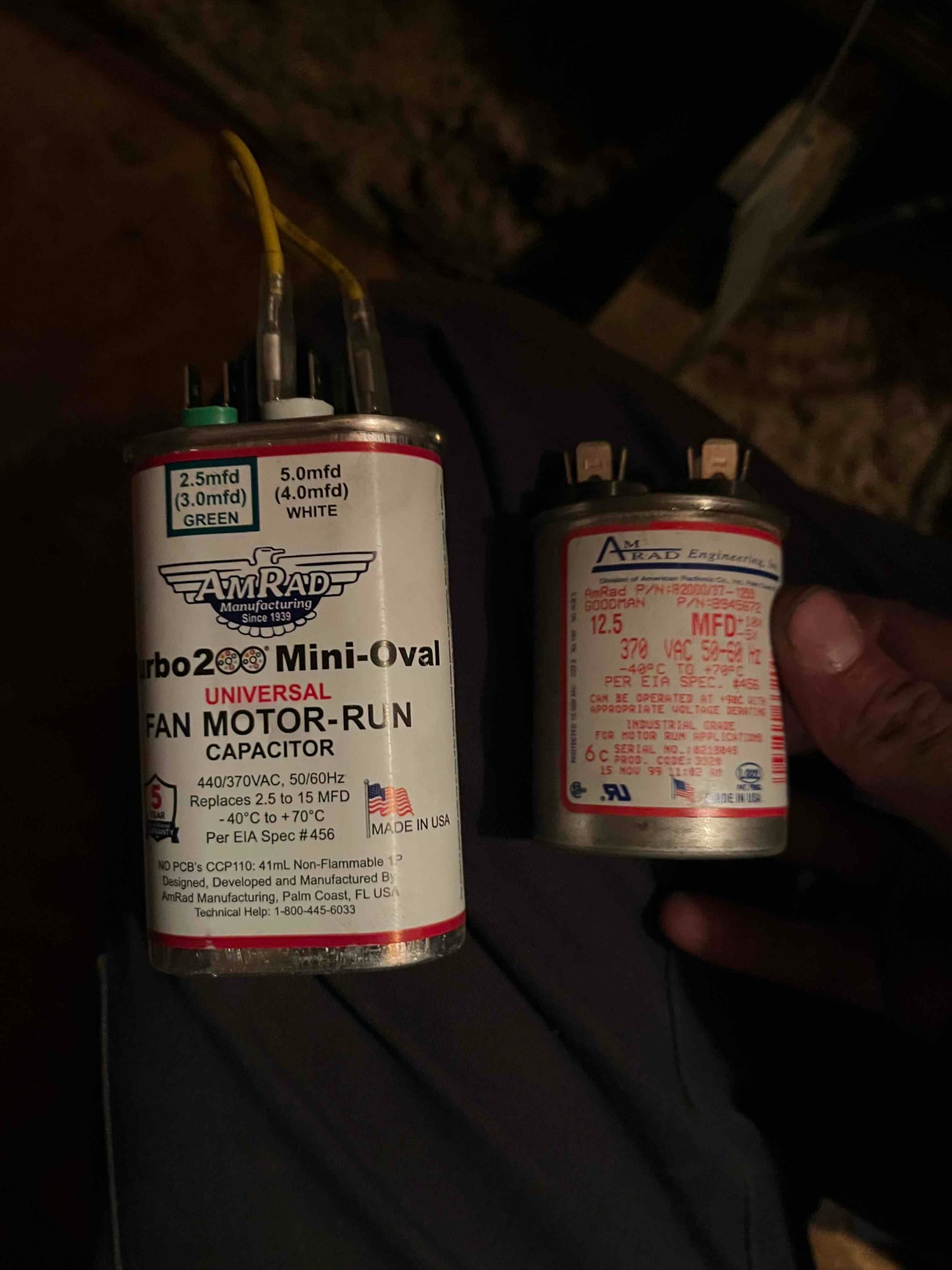 Two fan motor run capacitors shown side by side; left unit labeled universal 440/370 VAC with wiring attached.