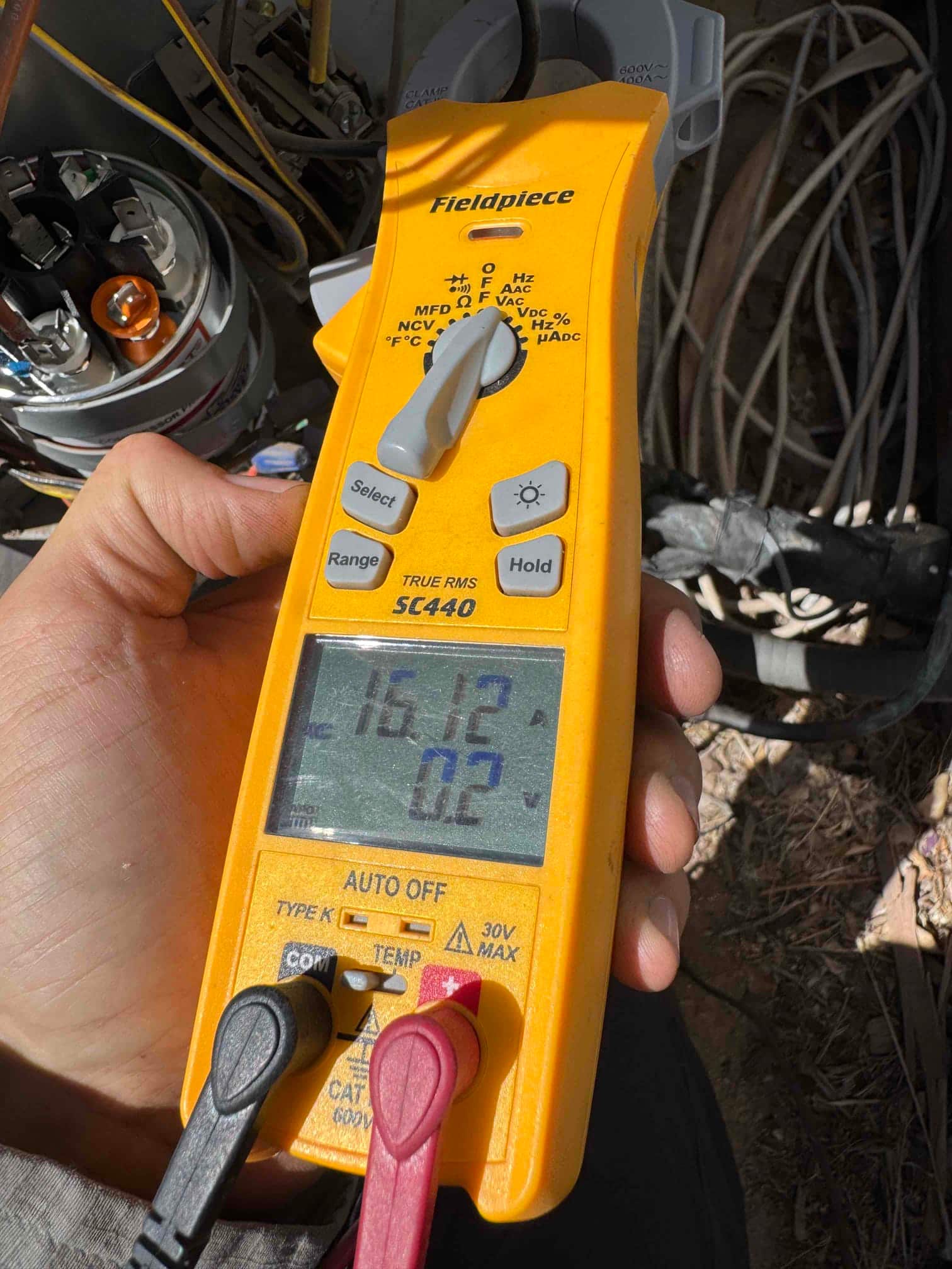 HVAC diagnostic instrument photographed during the service visit.