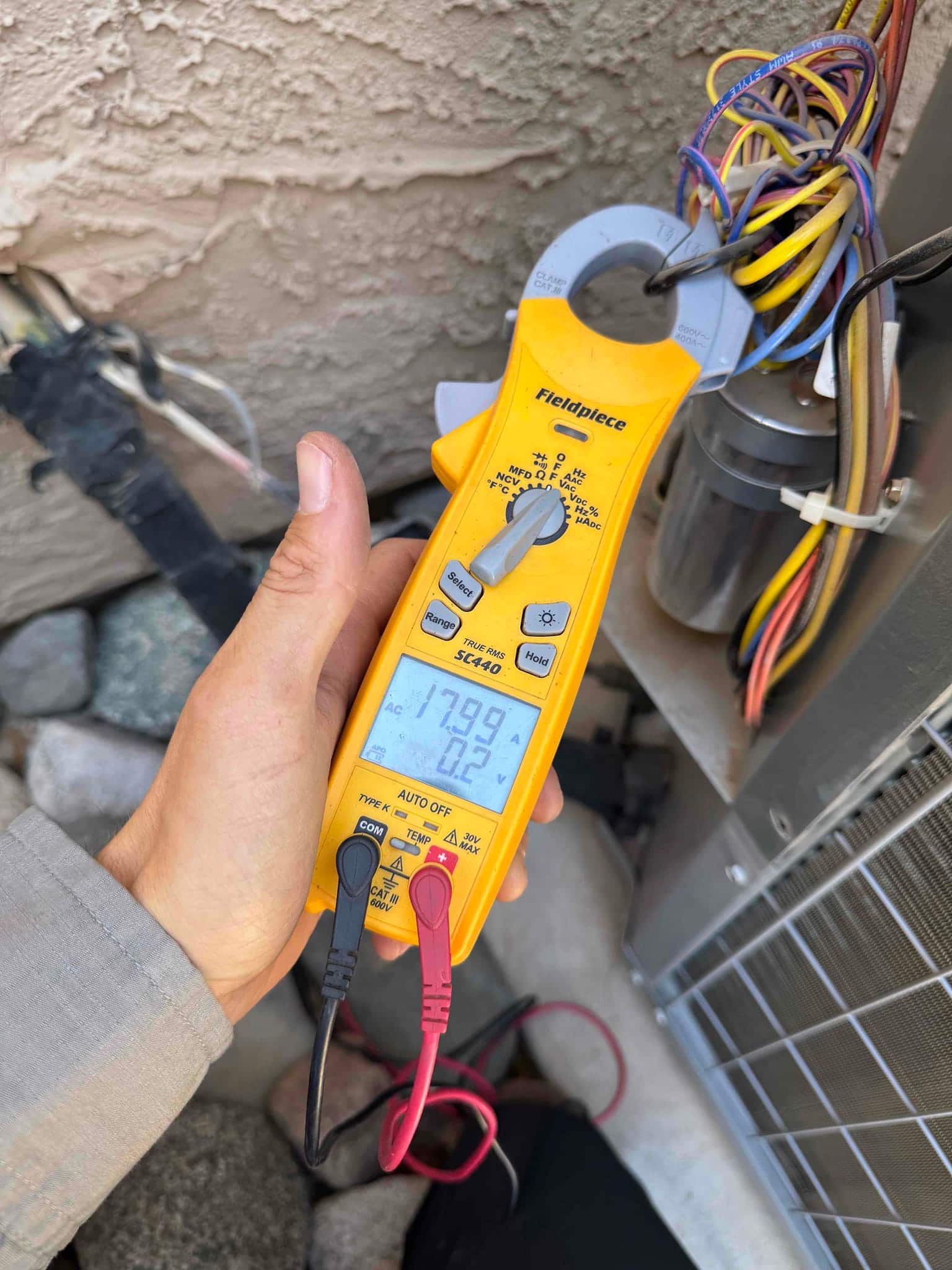 HVAC diagnostic instrument photographed during the service visit.