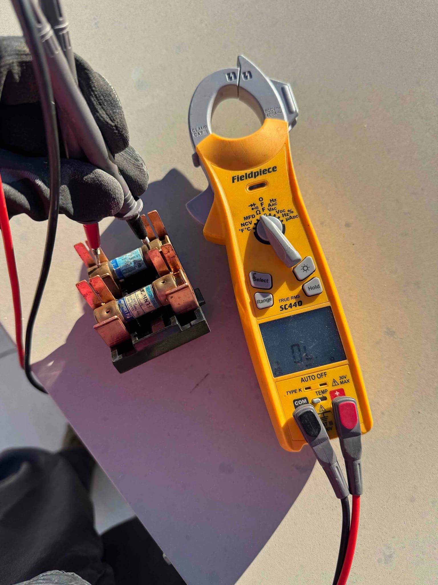 HVAC diagnostic instrument photographed during the service visit.
