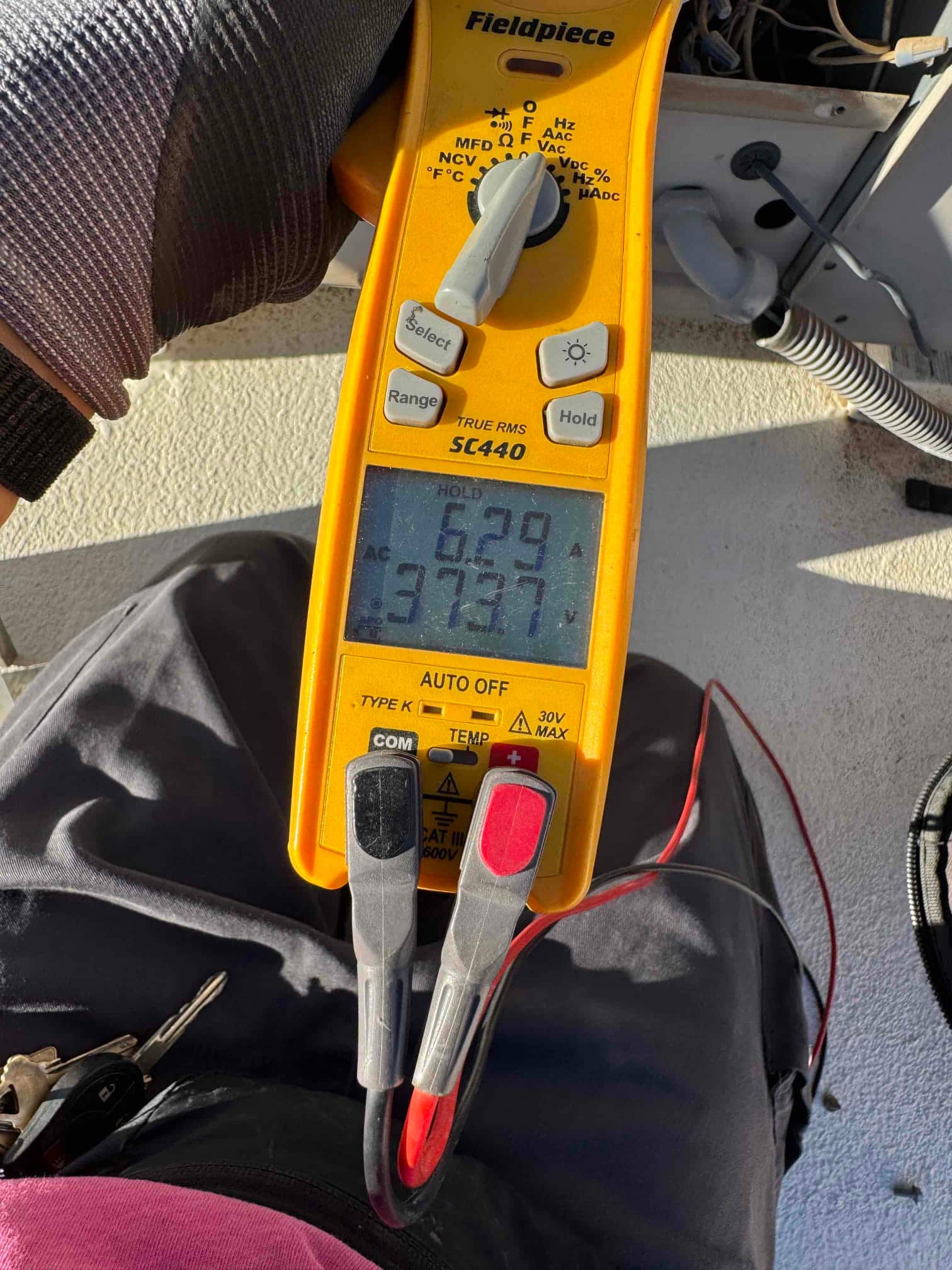 HVAC diagnostic instrument photographed during the service visit.