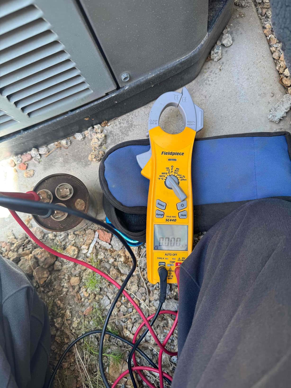 HVAC diagnostic instrument photographed during the service visit.