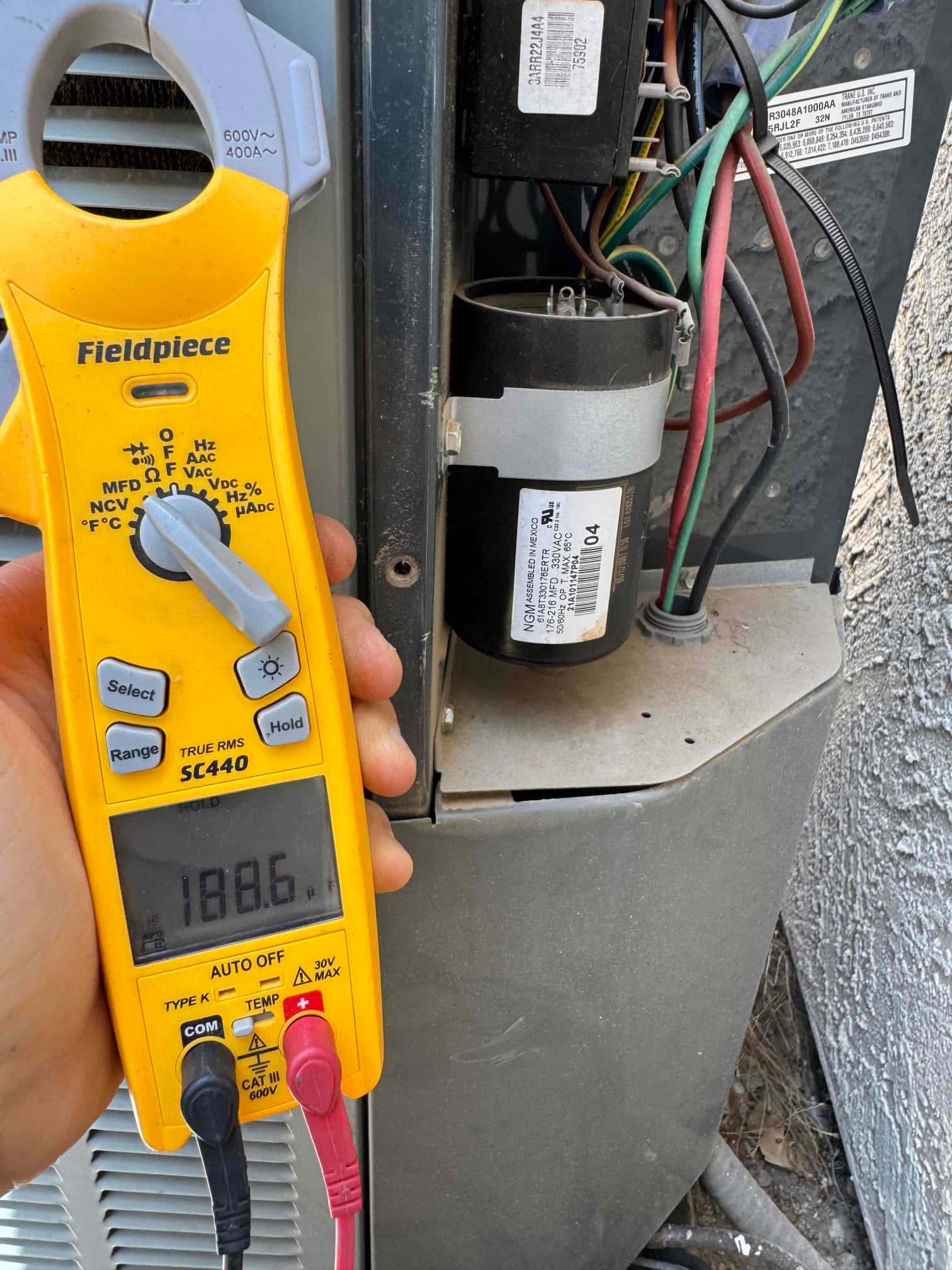 HVAC diagnostic instrument photographed during the service visit.