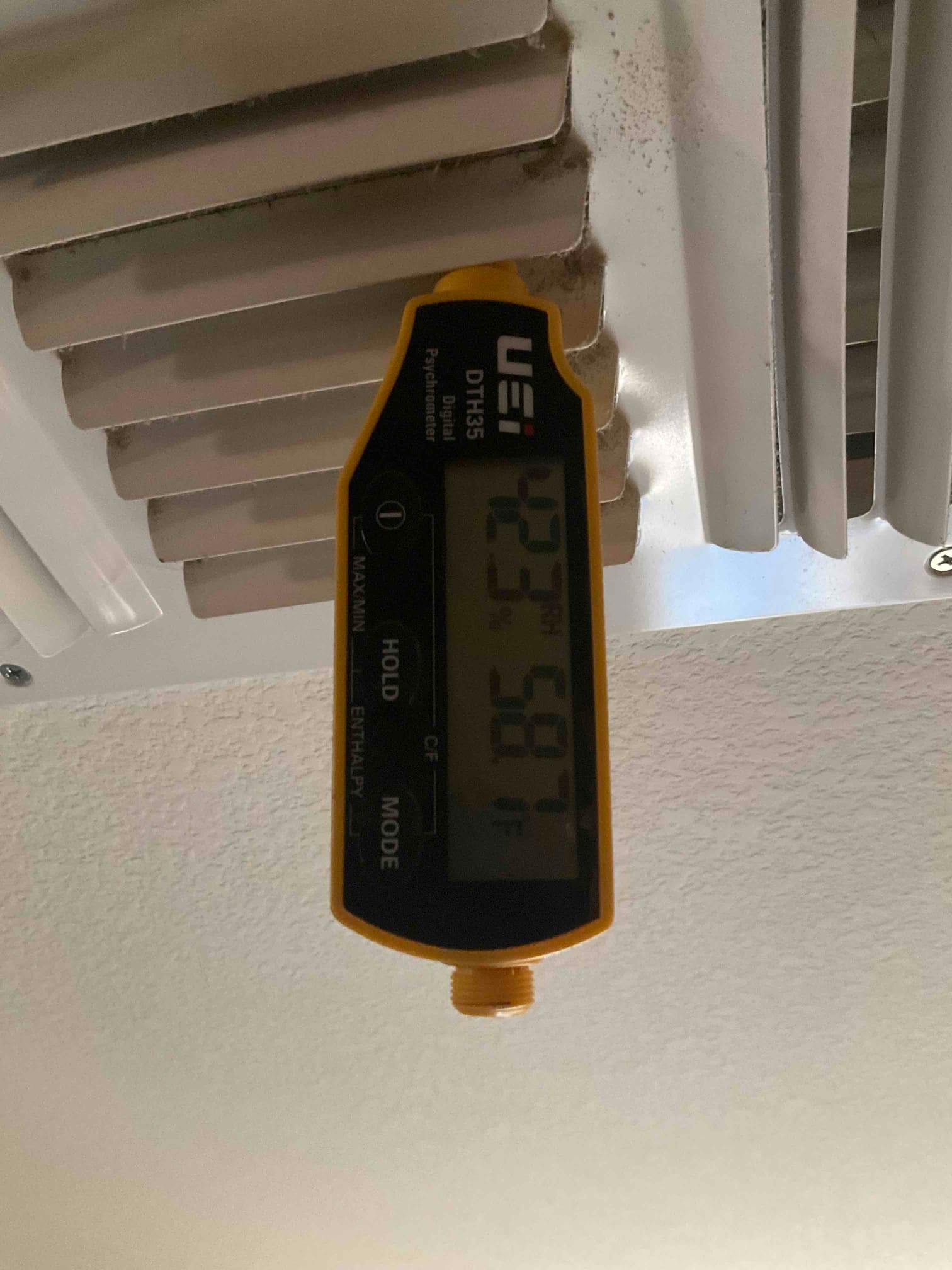 HVAC diagnostic instrument photographed during the service visit.