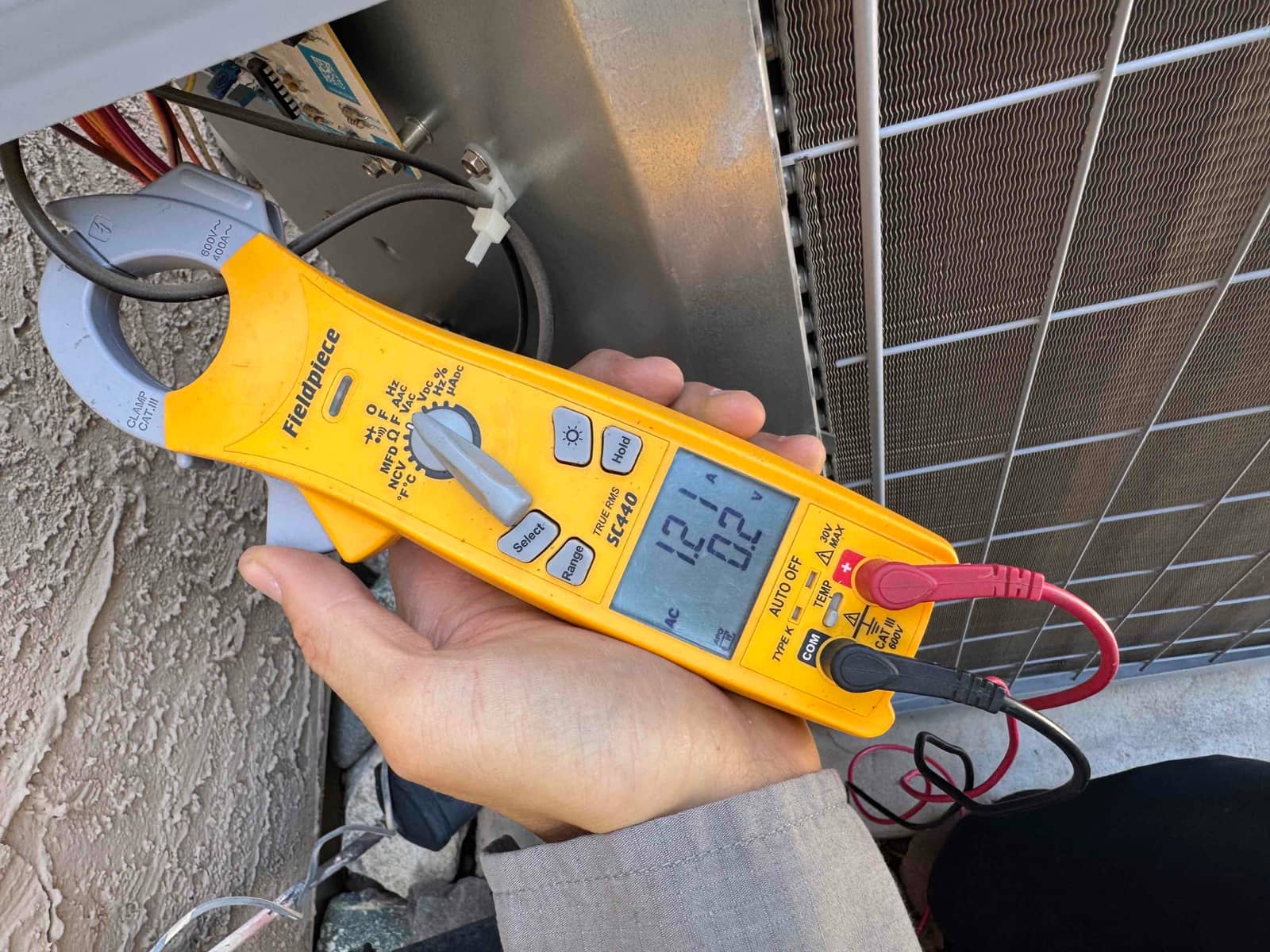 HVAC diagnostic instrument photographed during the service visit.