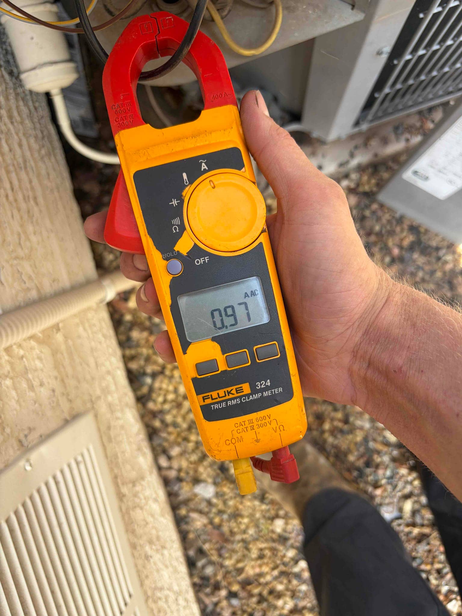 HVAC diagnostic instrument photographed during the service visit.