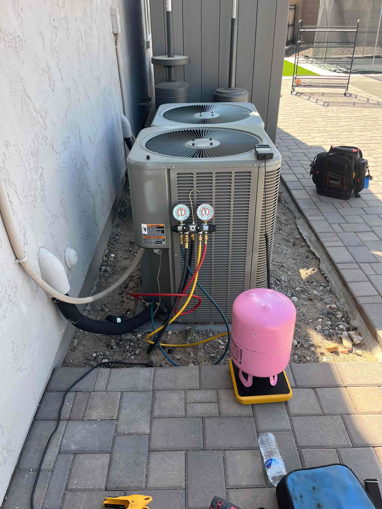 Refrigerant scale photographed during the service visit; no numerical reading is transcribed.