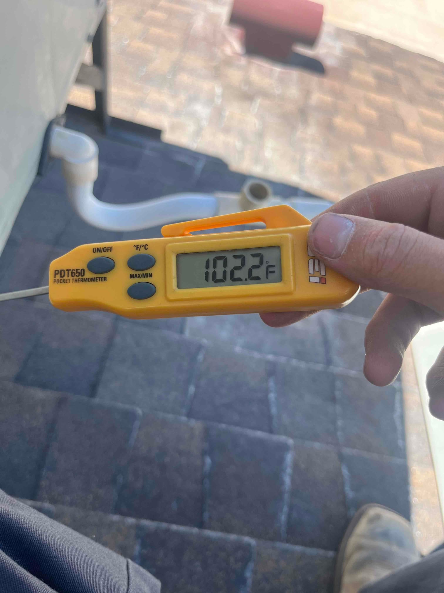 Diagnostic instrument display shows 102.2 °F.