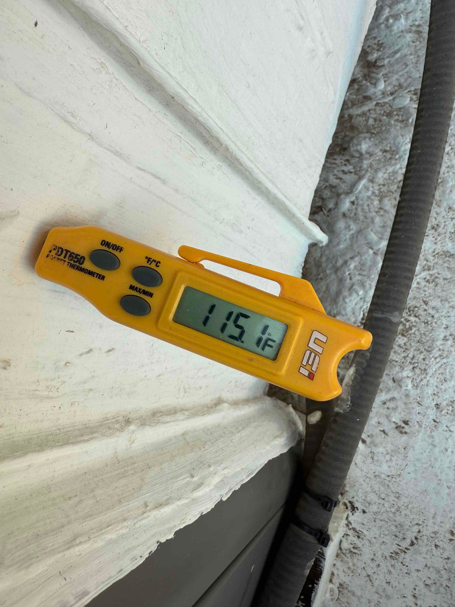 Diagnostic instrument display shows 115.1 °F.